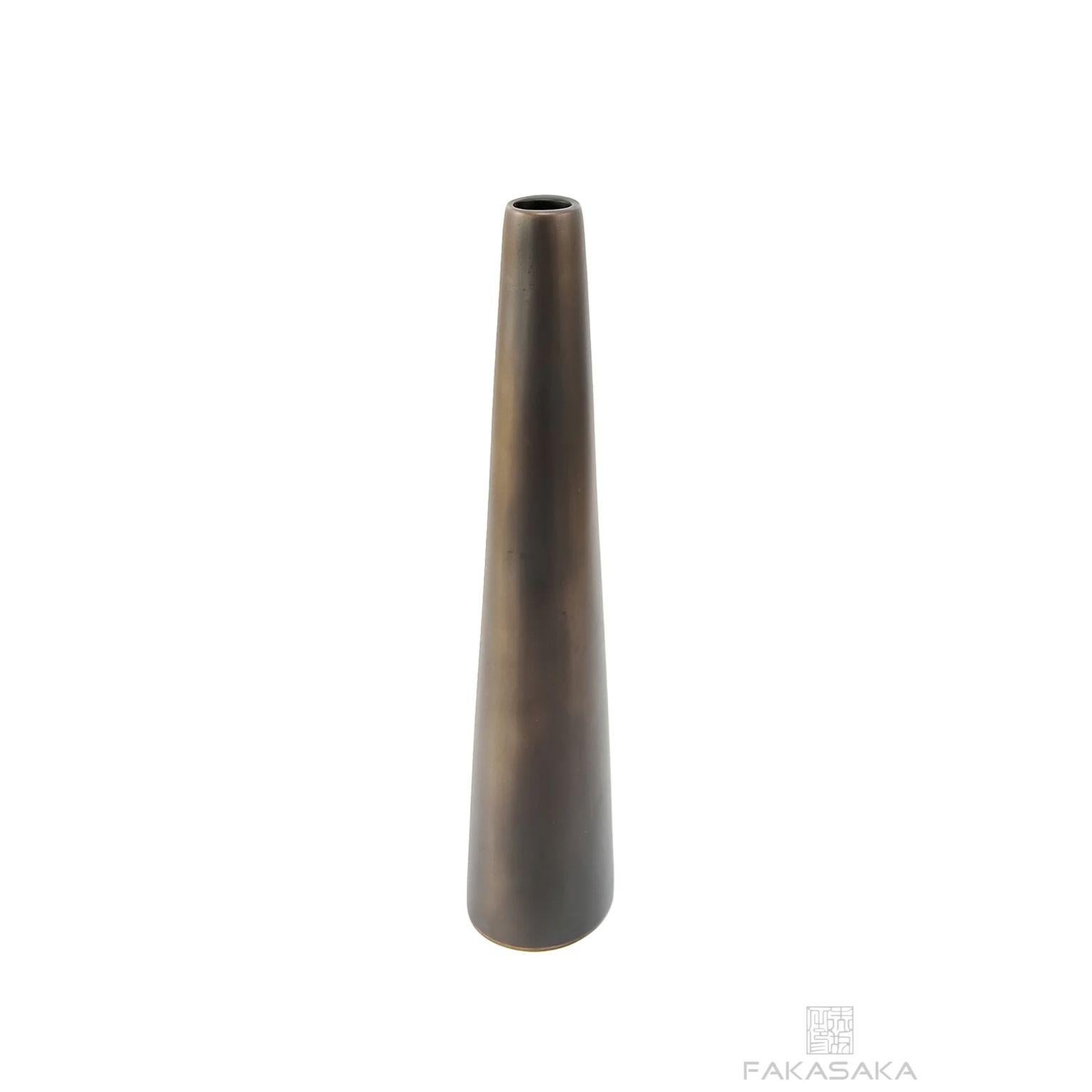 Heather candleholder by Fakasaka Design.
Dimensions: W 9.5 cm D 5.5 cm H 29.5 cm.
Materials: dark bronze.
Also available in polished bronze.

 Fakasaka is a design company focused on production of high-end furniture, lighting, decorative