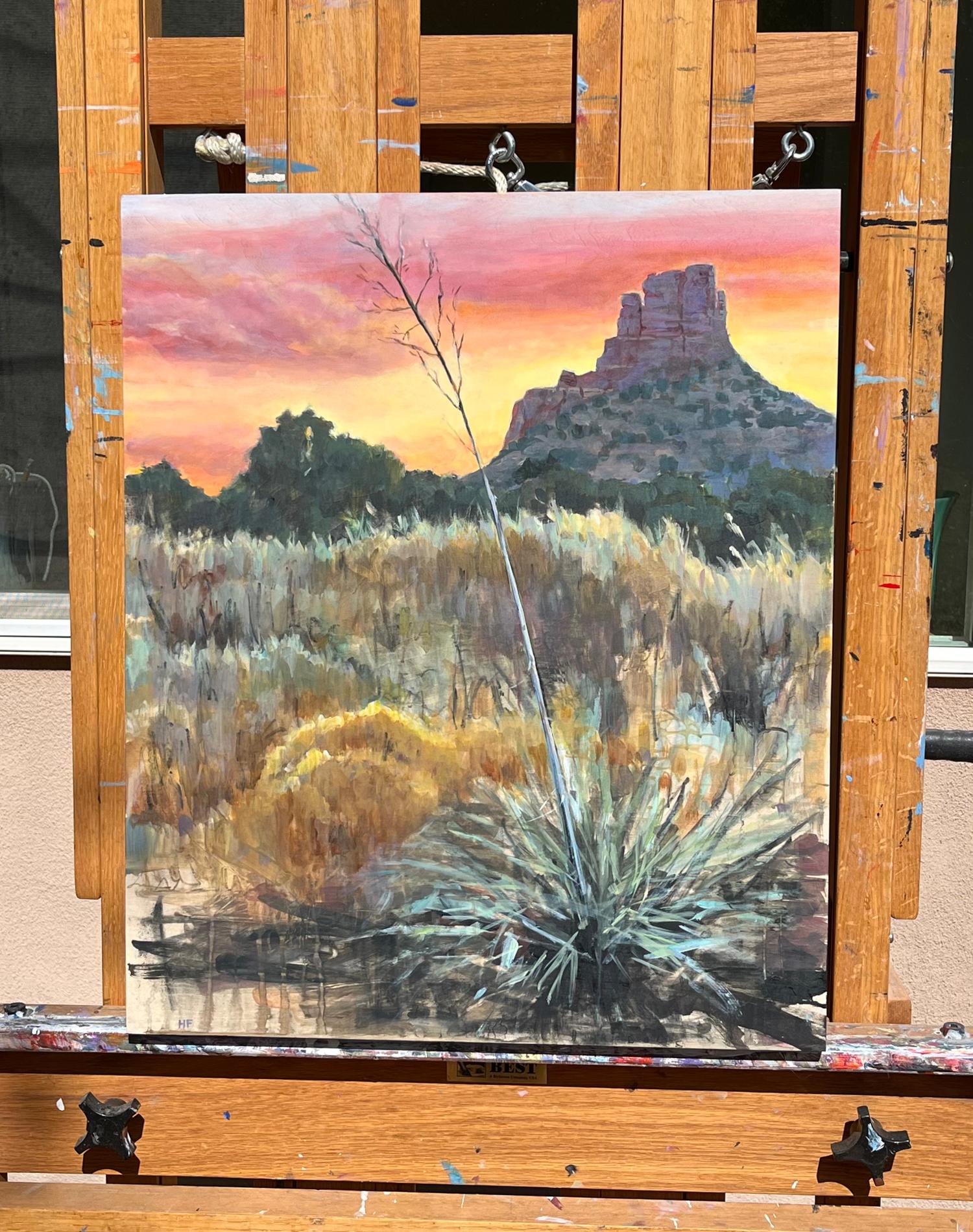 <p>Artist Comments<br />A yucca stretches toward the fiery Sedona sunset, where bright oranges and pinks fill the sky. Soft brushstrokes blend dry grasses with rugged terrain. By incorporating repurposed charcoal collected from a forest fire and a