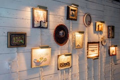 "Salon 13" is a collection of 13 small mixed media pieces with electric lighting