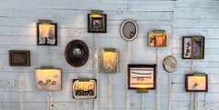 "Salon 13" is a collection of 13 small mixed media pieces with electric lighting