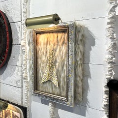 "Specimen", frame with electric picture light, faux fur, paper, pins, on board