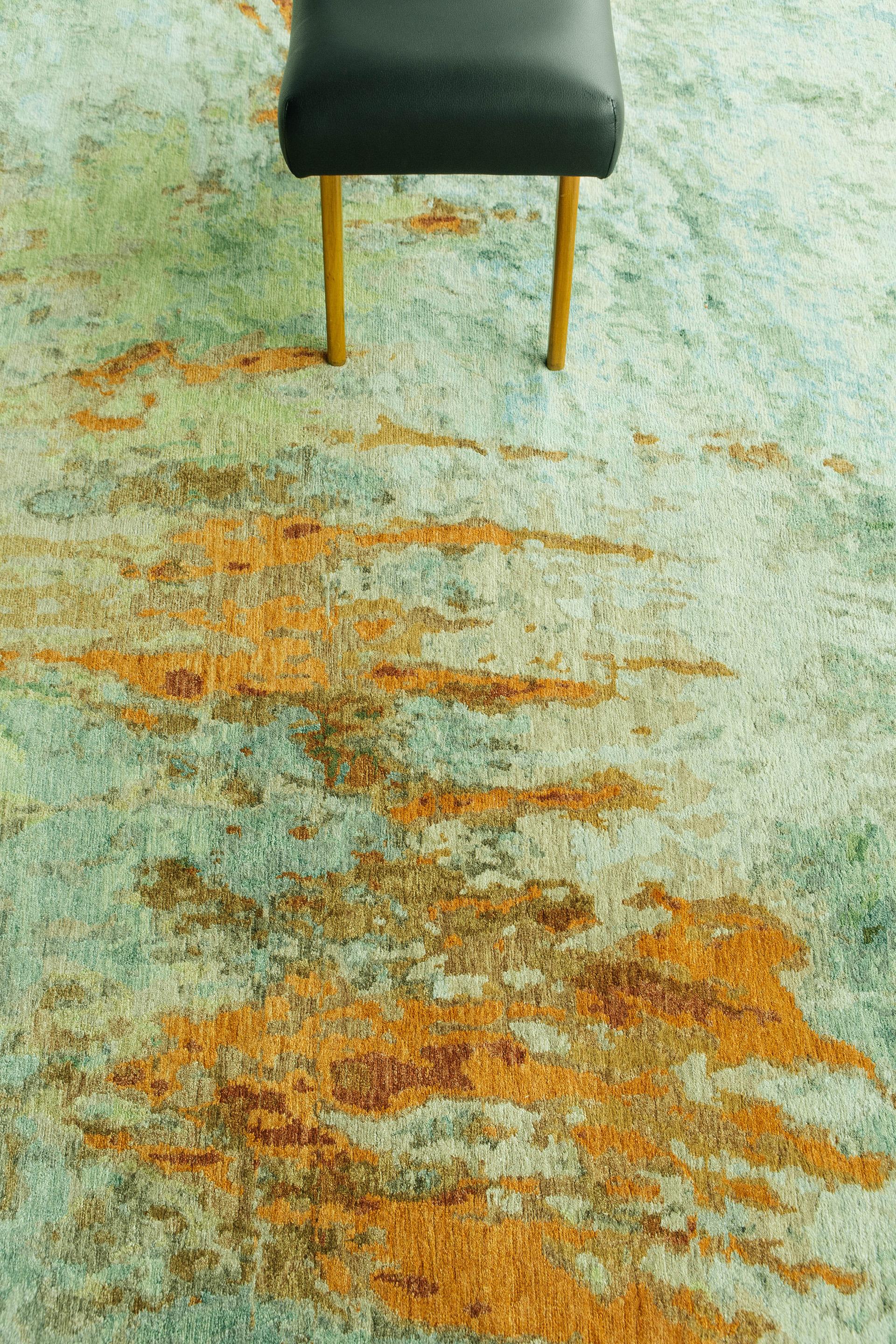 Various green colors and spontaneous strokes of amber and rust keep your eye engaged when looking at this wool and silk piece. The complementary colors bring a unique and inviting appeal to this earth-toned rug.

Rug number 26002
Size: 9' 0