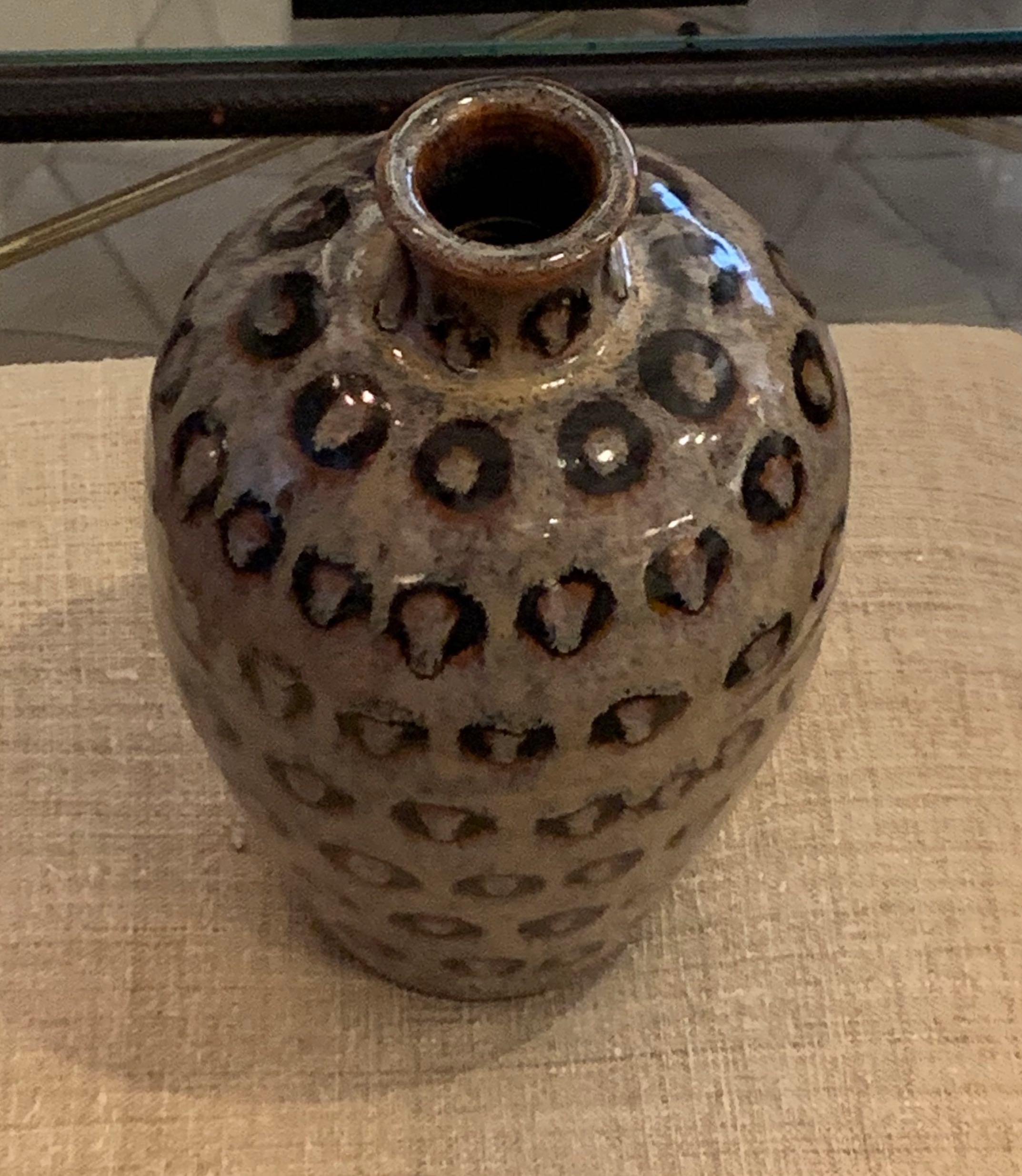 Contemporary Chinese heather taupe vase with hand painted black circle design.
Sits nicely with a collection of circle design hand painted vases.
S5667, S5669