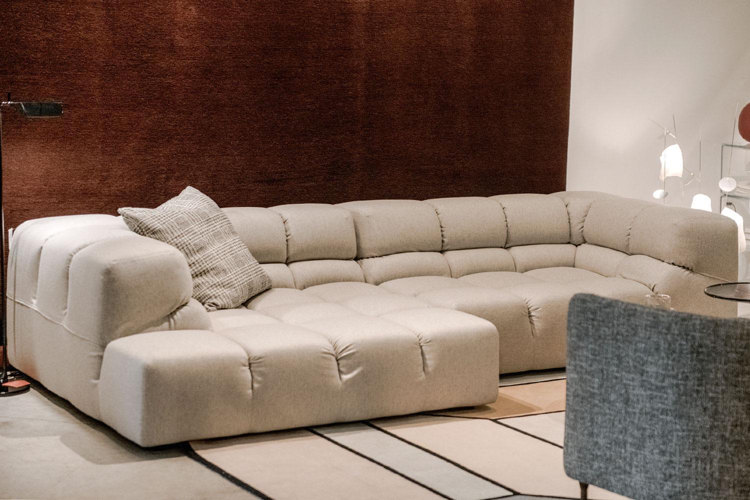 This Tufty-Time sectional is inspired by the creativity of Patricia Urquiola. Modular and adaptable, Tufty-Time's upholstered large squares and kick pleat, the covers create an undeniably contemporary look. Steel internal frame with black legs.