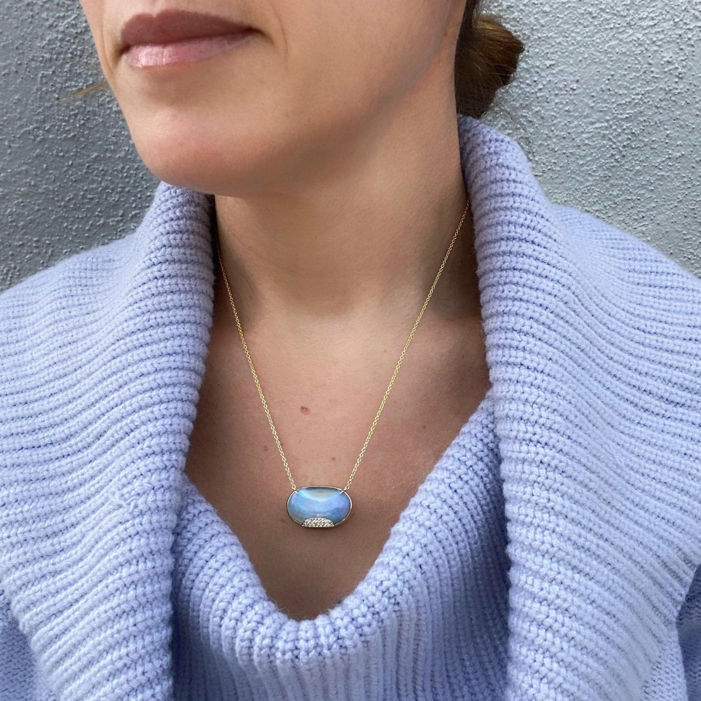 An unearthly Blue Opal is the inspiration for the Heaven's Muse Gold Australian Boulder Opal Necklace.  Its translucent blue hues are just heavenly, with iridescent flares of purple, green and the occasional pink flashing through its skyscape.  At