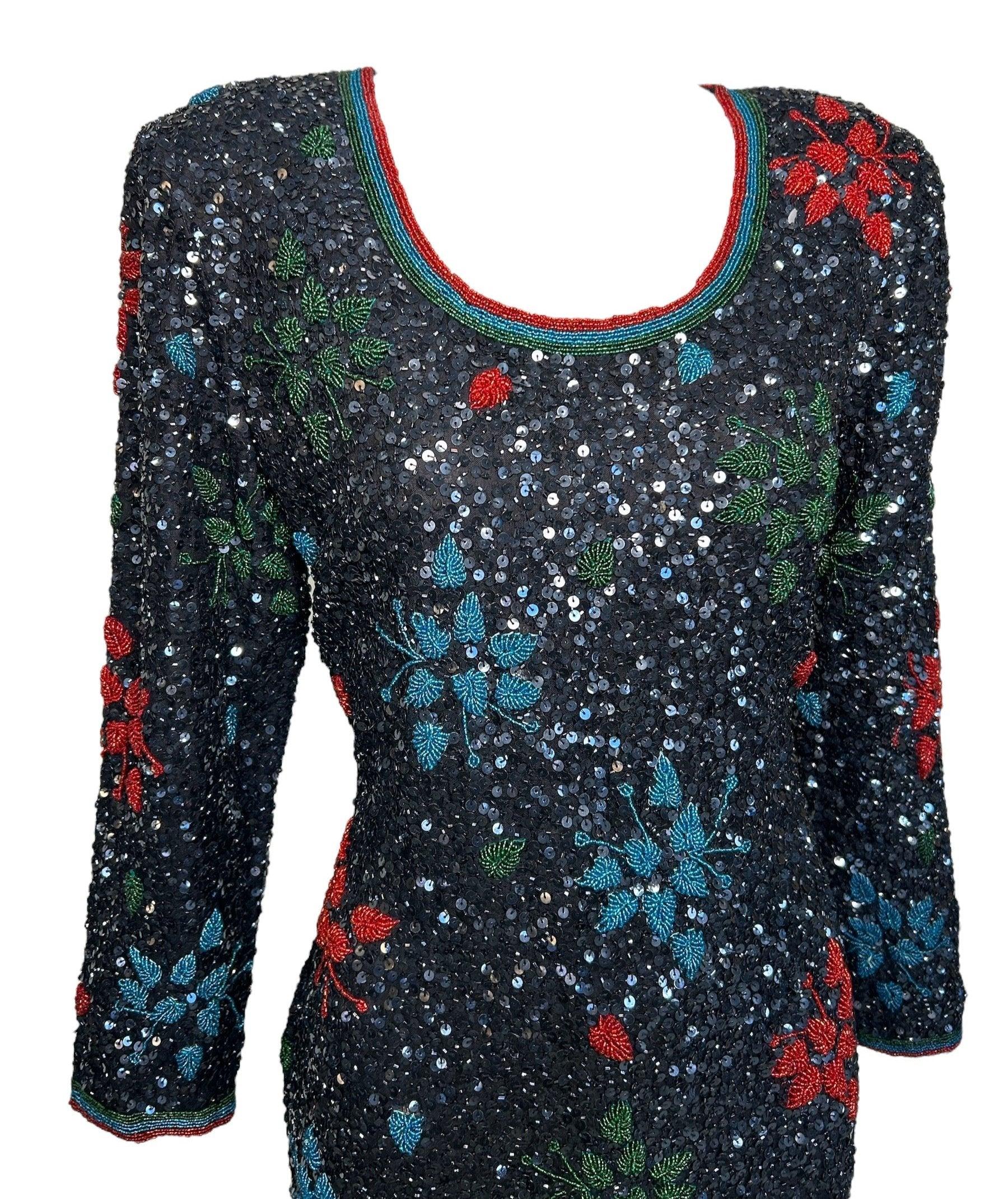 1980s Heavily Beaded & Sequined Tunic/ Micro Dress.  This micro dress features an incredible leaf motif, heavily embellished with dazzling sequins and beads on silk. Made in India. The bold red, blue, and green leaf design will make you stand out