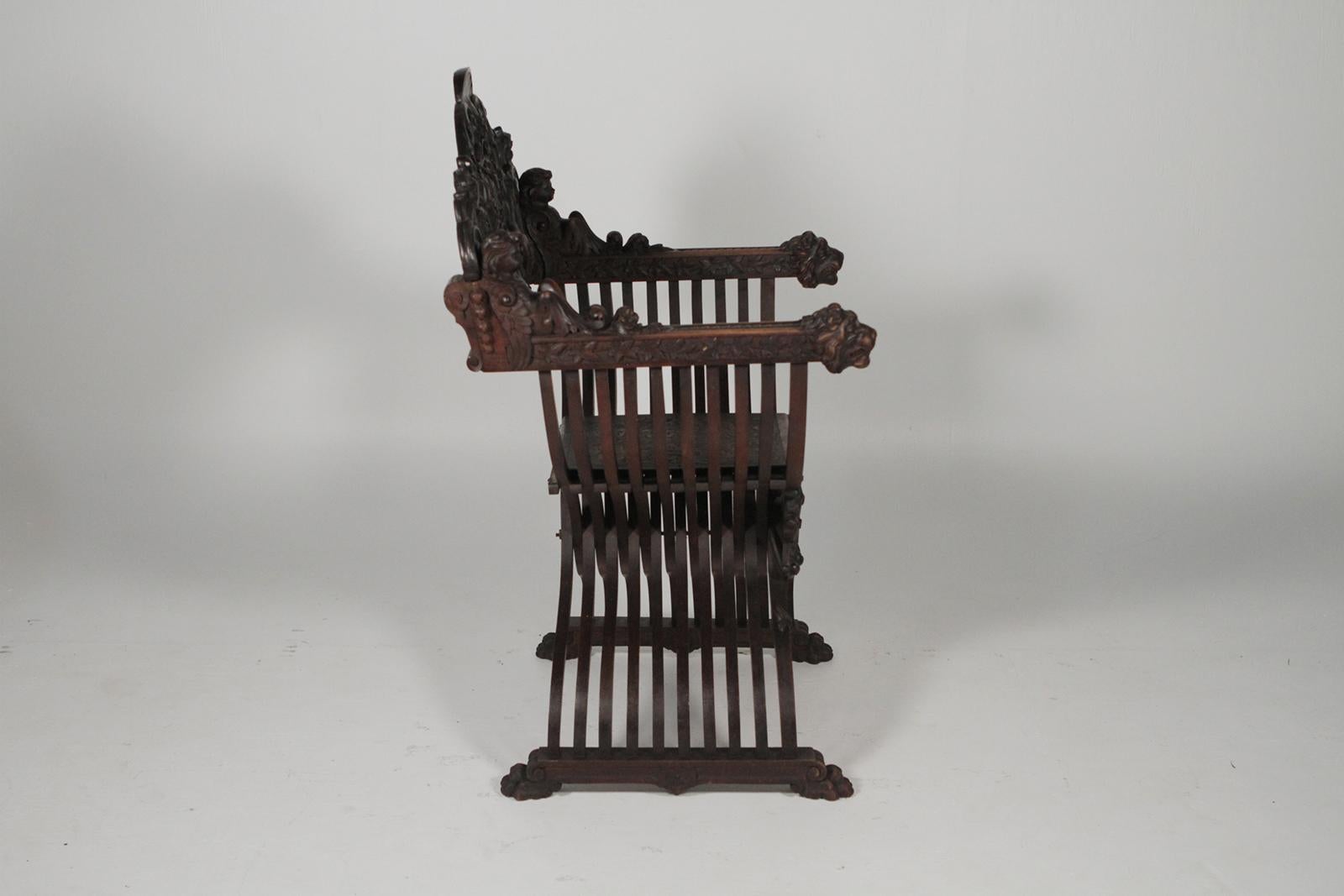 Neoclassical Revival Heavily Carved Campaign Chair, circa 1890s