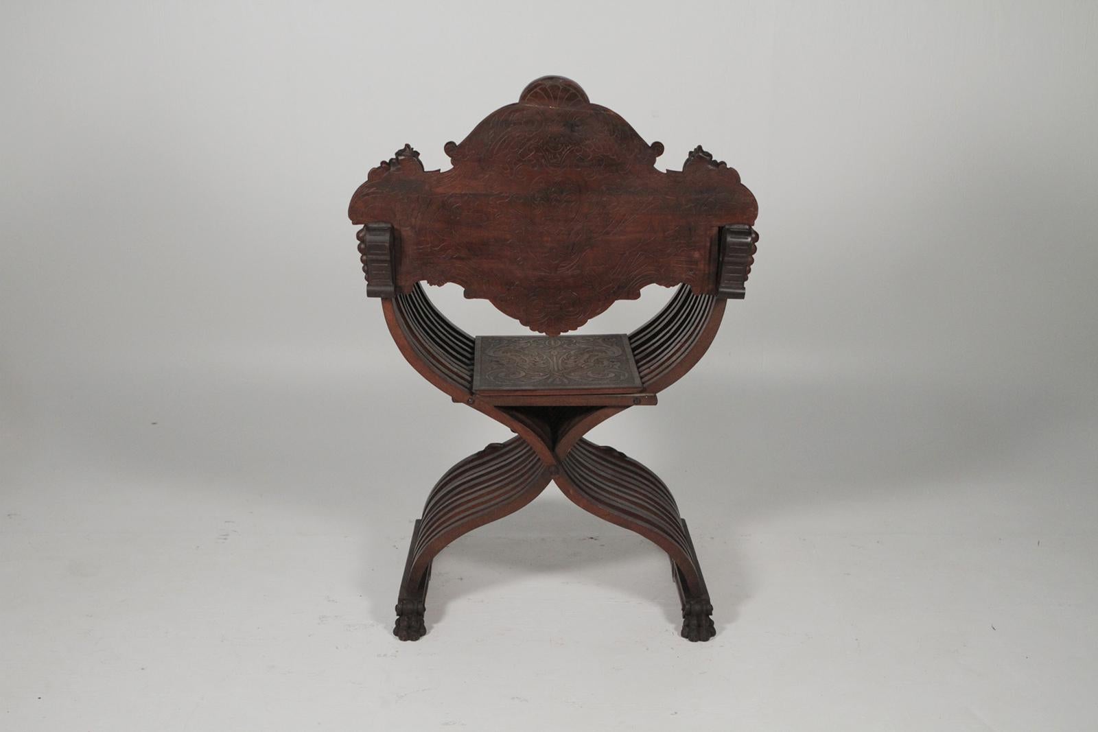 European Heavily Carved Campaign Chair, circa 1890s