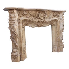Heavily Carved Cream Marble Fireplace