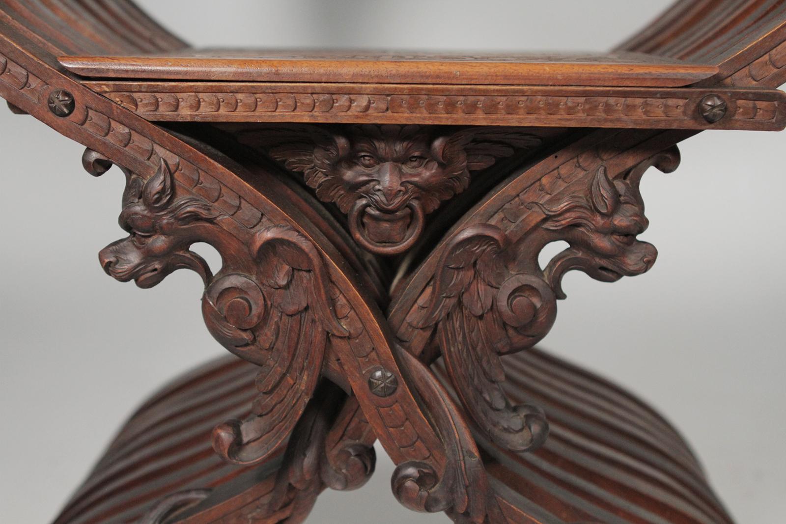 Heavily Carved Figural Campaign Chair, Lions, Cherubs, Dragons, circa 1890 For Sale 1