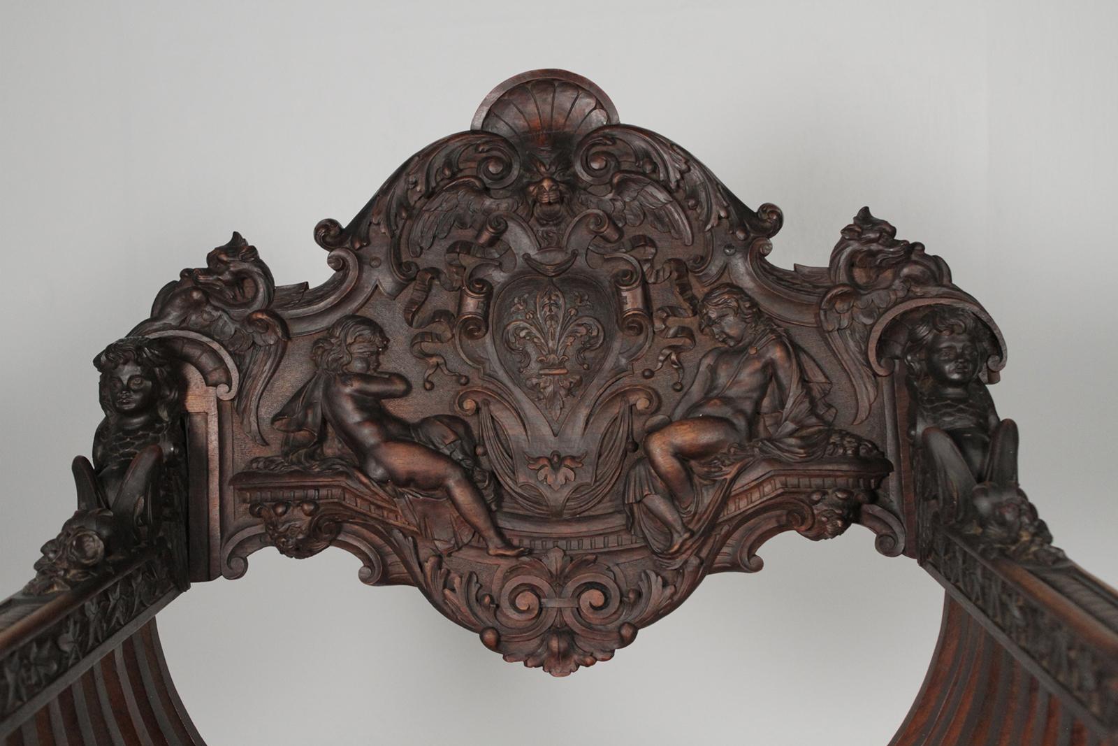 Neoclassical Revival Heavily Carved Figural Campaign Chair, Lions, Cherubs, Dragons, circa 1890
