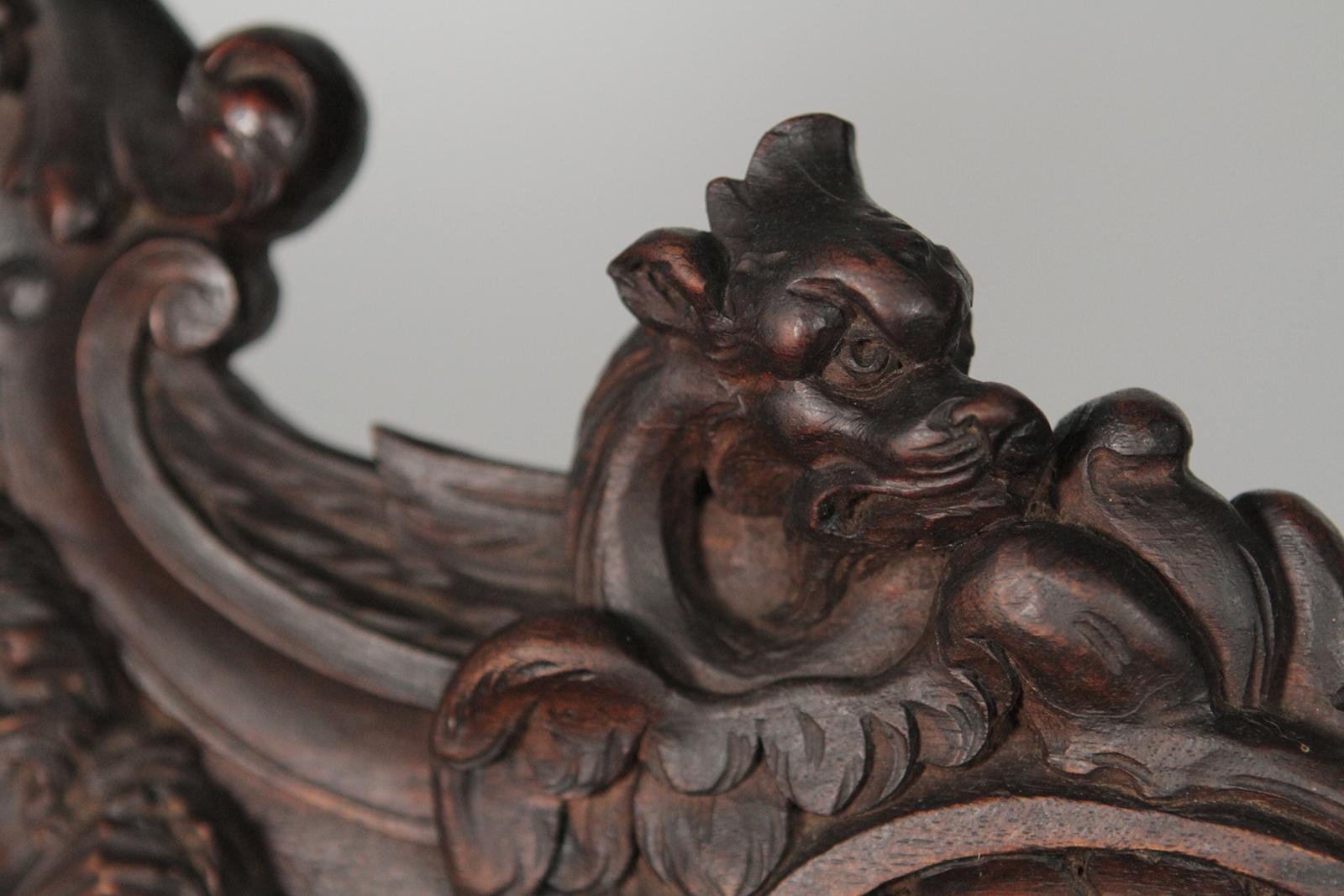 Late 19th Century Heavily Carved Figural Campaign Chair, Lions, Cherubs, Dragons, circa 1890 For Sale