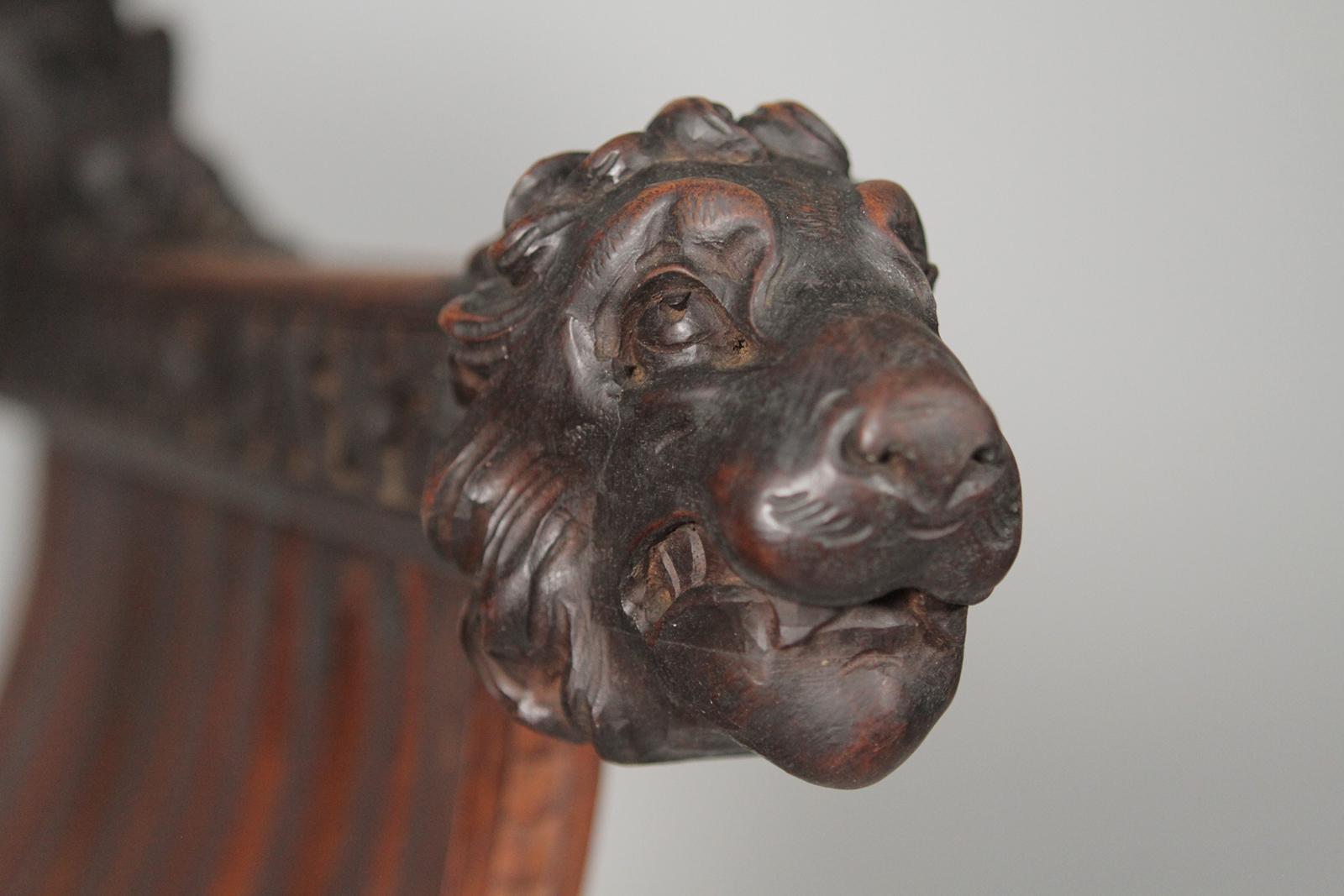 Walnut Heavily Carved Figural Campaign Chair, Lions, Cherubs, Dragons, circa 1890 For Sale