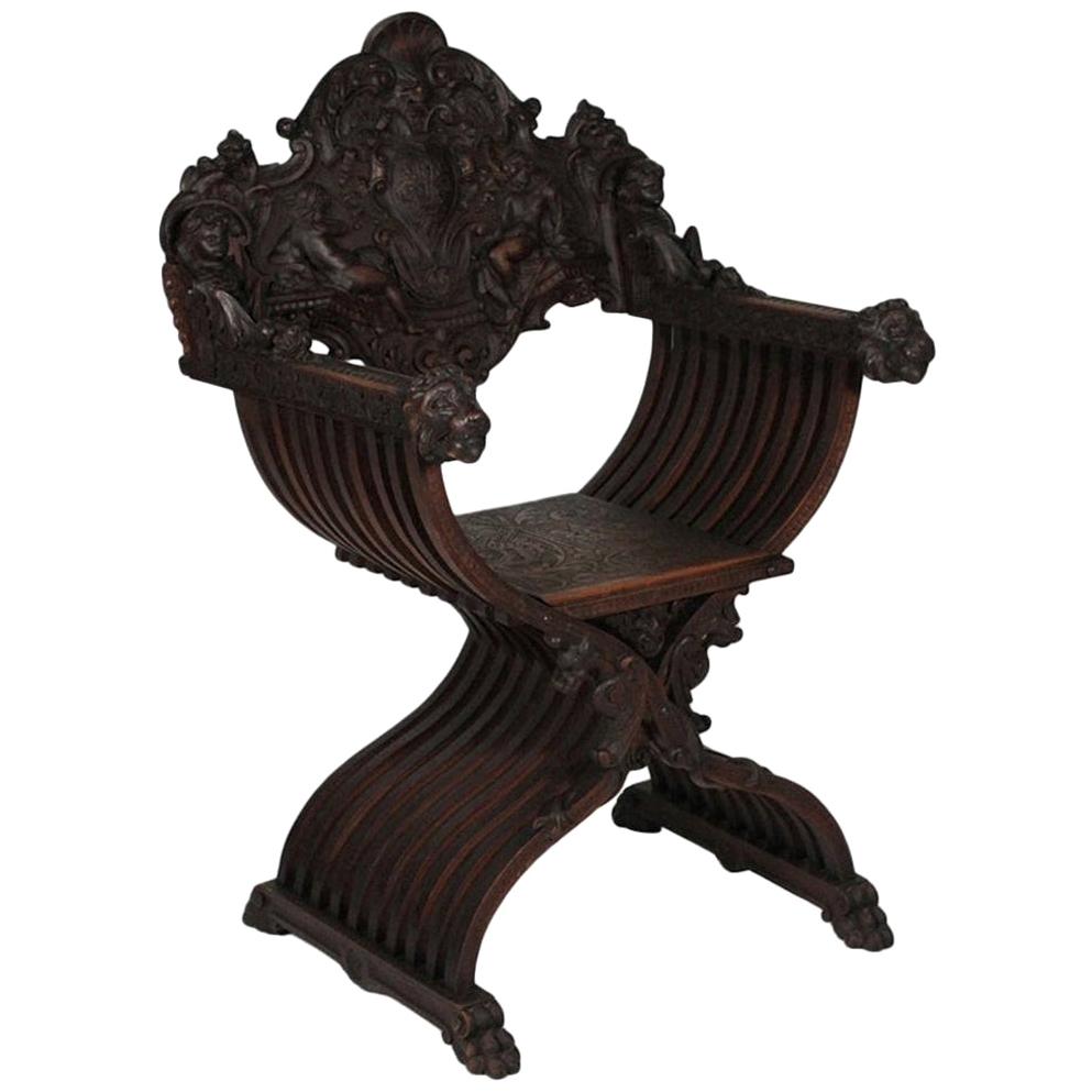 Heavily Carved Figural Campaign Chair, Lions, Cherubs, Dragons, circa 1890 For Sale