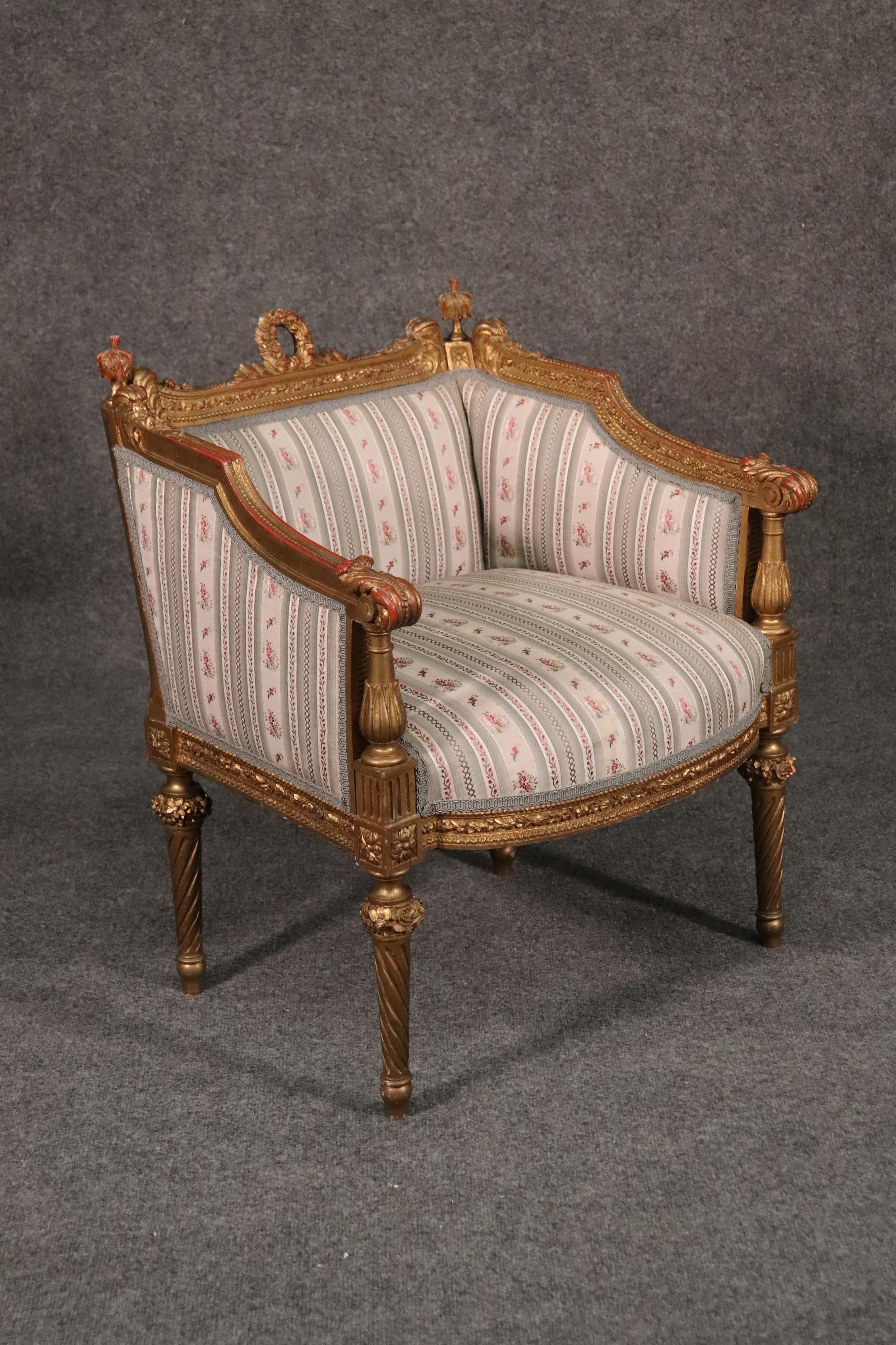 This is a truly gorgeous chair. Gilded over a red clay bole ground, this gorgeous chair is in good condition and feature meticulously carved details and a beautiful design. The chair dates to the 1890s and measures 27 tall x 24 wide x 21 deep. The