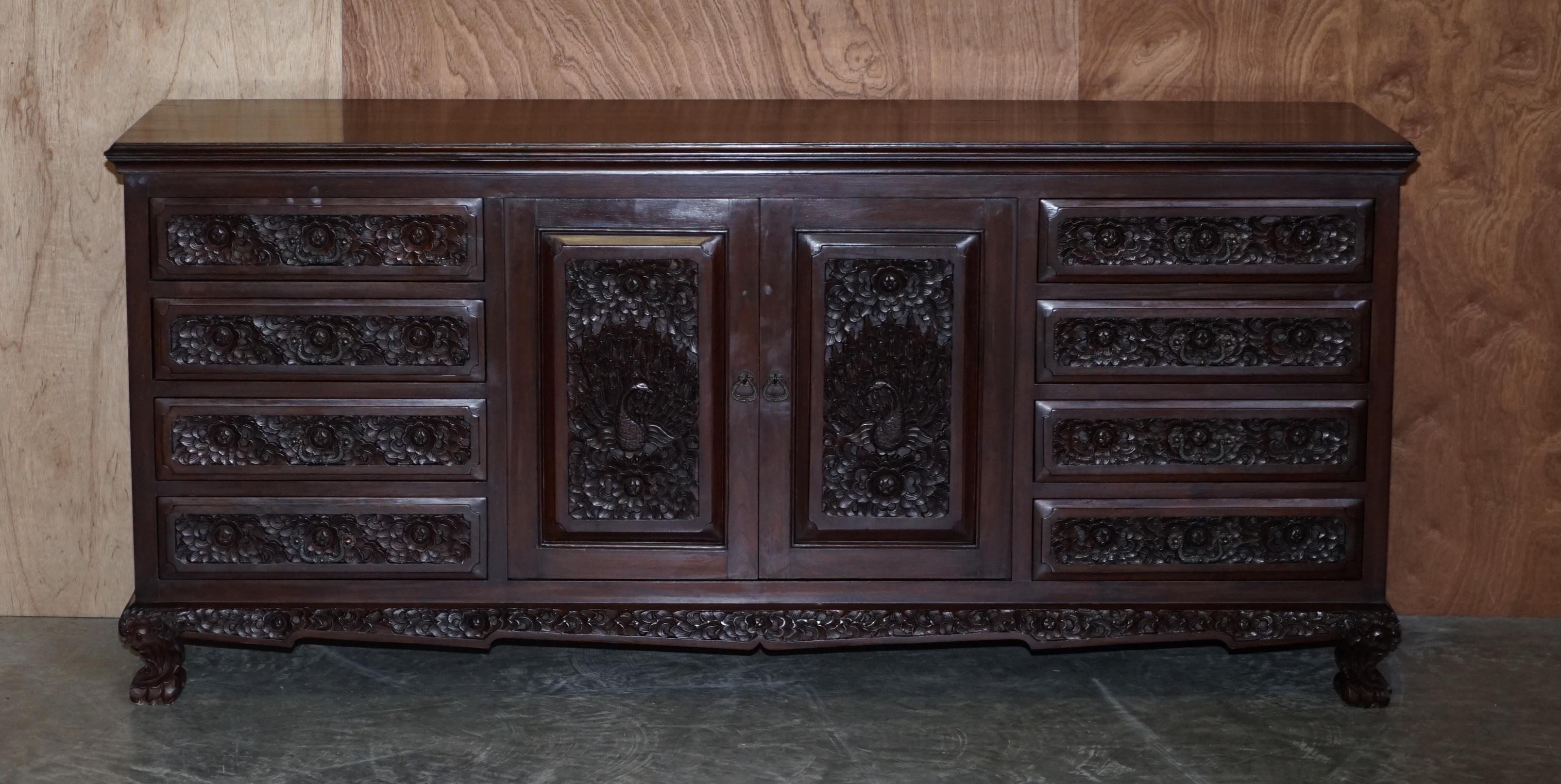 We are delighted to offer for sale this lovely hand carved Indian Rosewood sideboard with drawers

A good looking and nicely made piece, its very decorative being heavily carved from top to bottom, this is like art furniture, you have floral