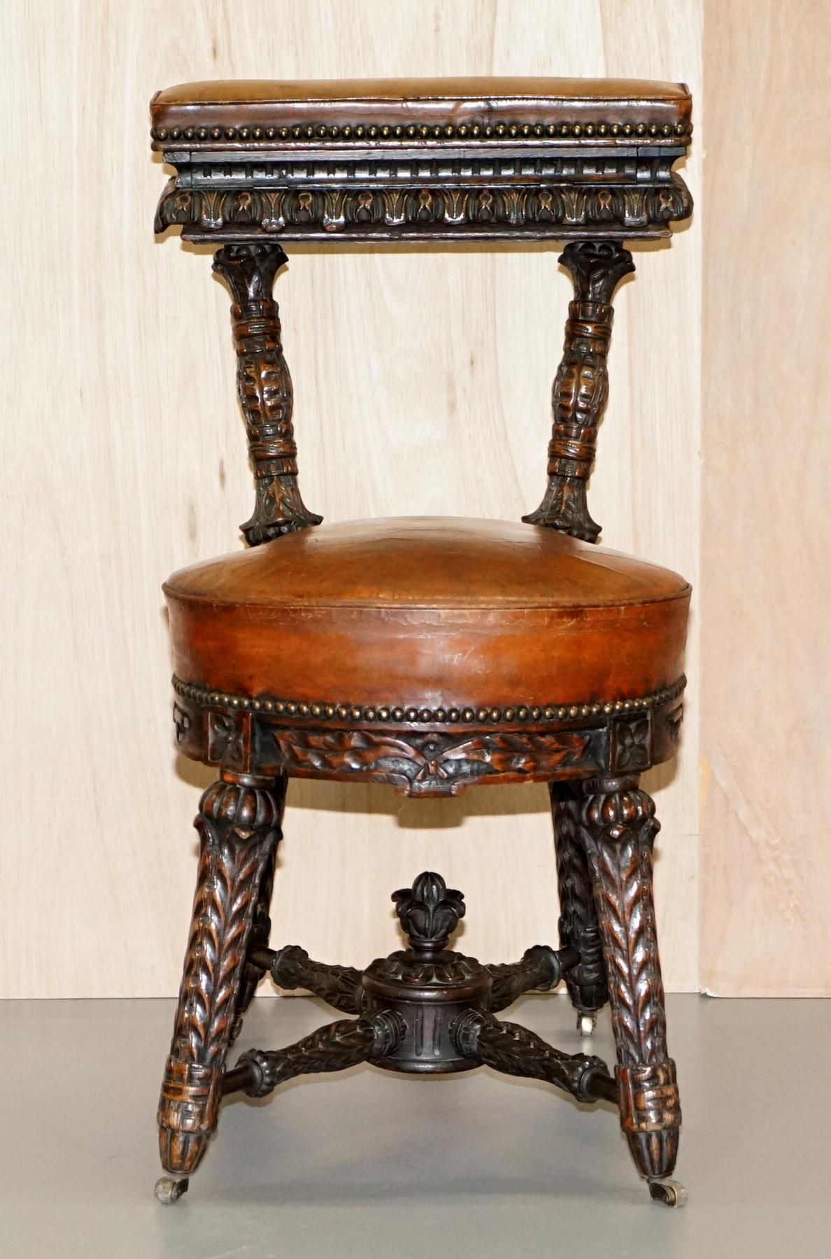 We are delighted to offer for sale this stunning heavily carved original circa 1850 metamorphic Cockfighting chair in brown leather

A very rare and beautifully hand carved chair with original leather upholstery and castors. This chair was