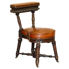 Heavily Carved Metamorphic Cock Fighting Chair circa 1850 Brown Leather Drawers