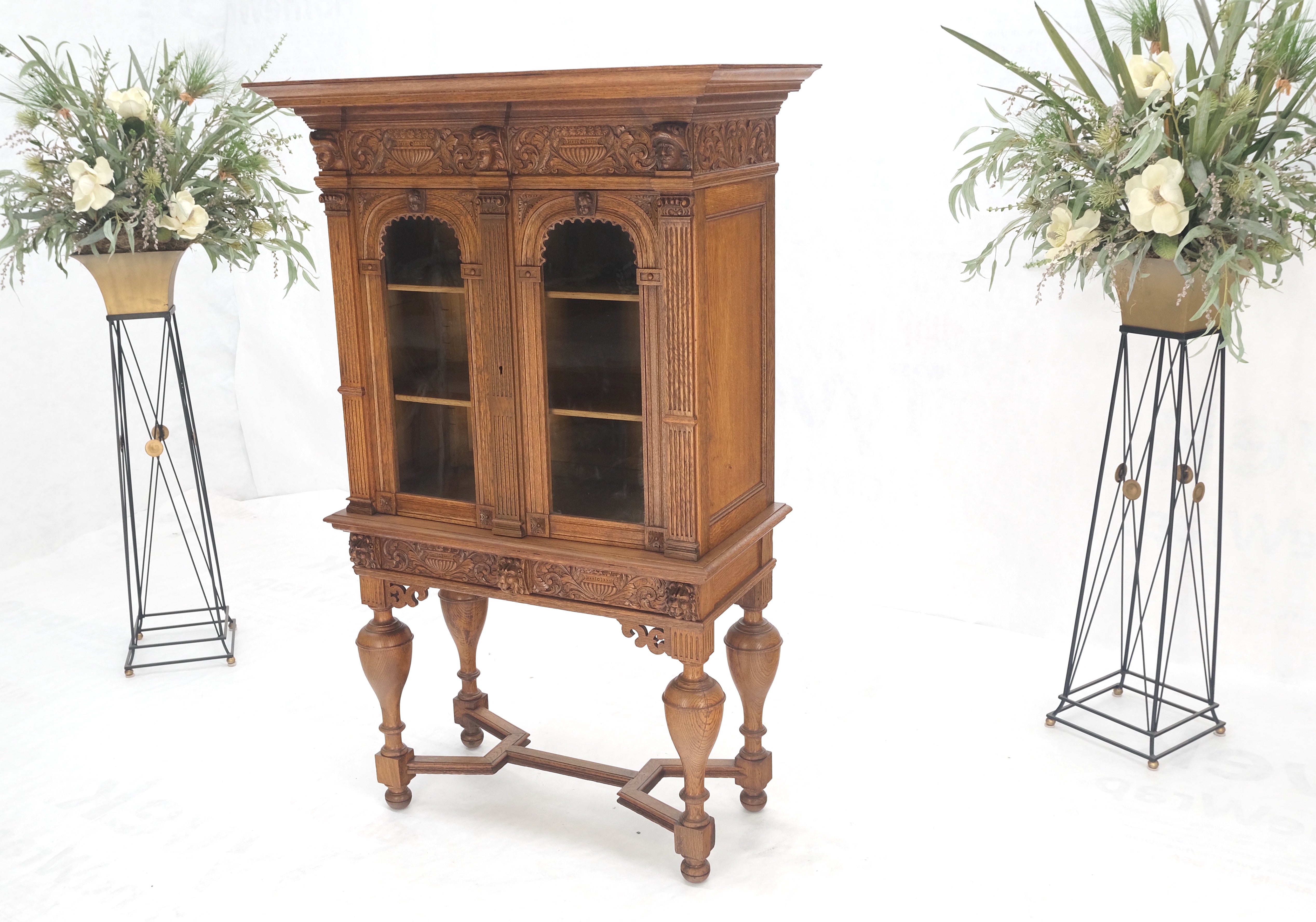 Heavily Carved Oak Faces Urns Motive Two Door China Cabinet c1880s MINT!
Adjustable shelves