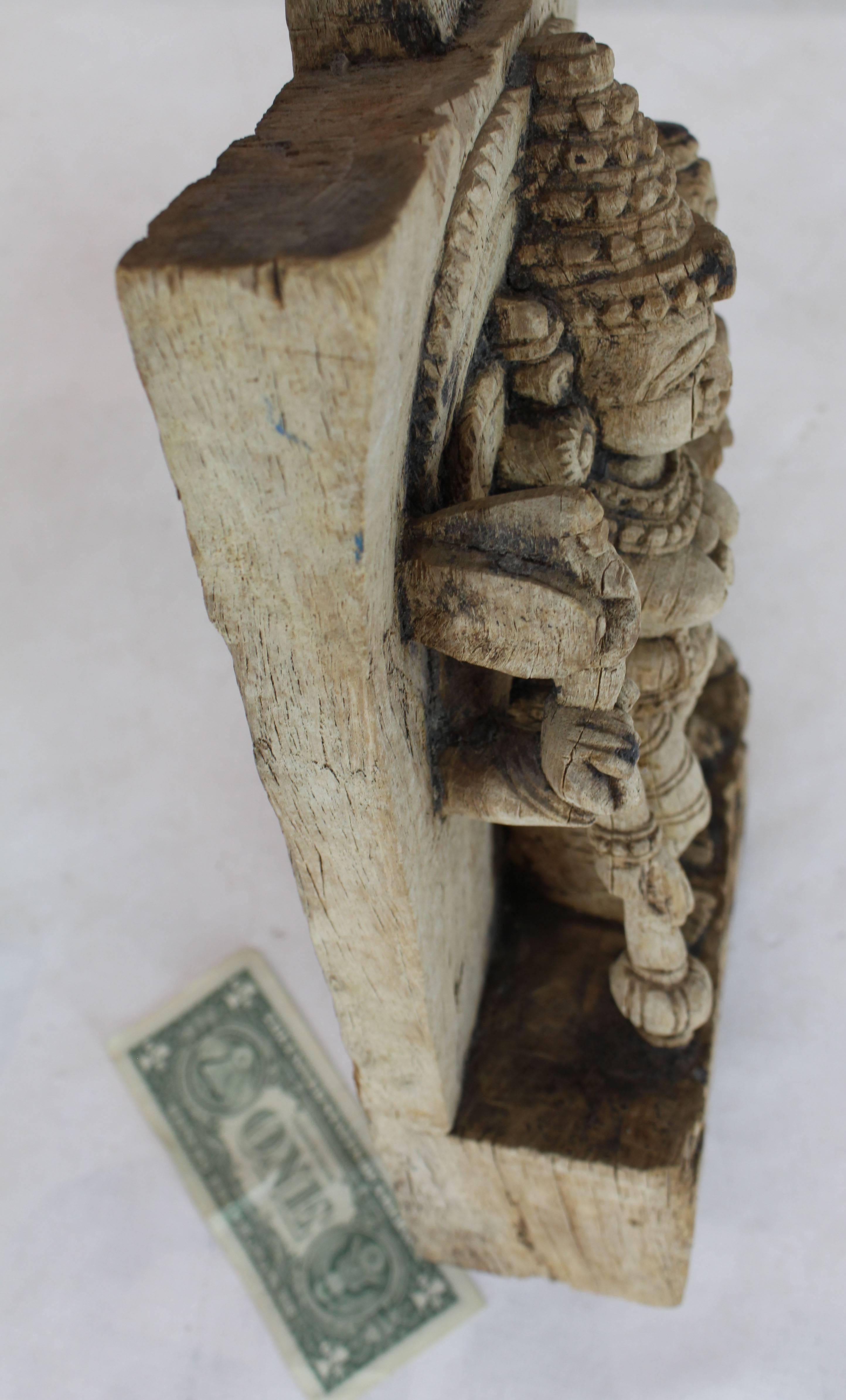 Very old antique Indian Goddess wall sculpture. Heavily hand-carved piece. The wood is very hard feels nearly petrofied. Nice patina and aging details.