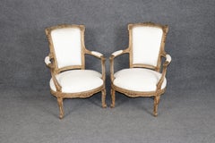 Heavily Carved Pair of French Signed Maison Jansen Distressed Painted Armchairs