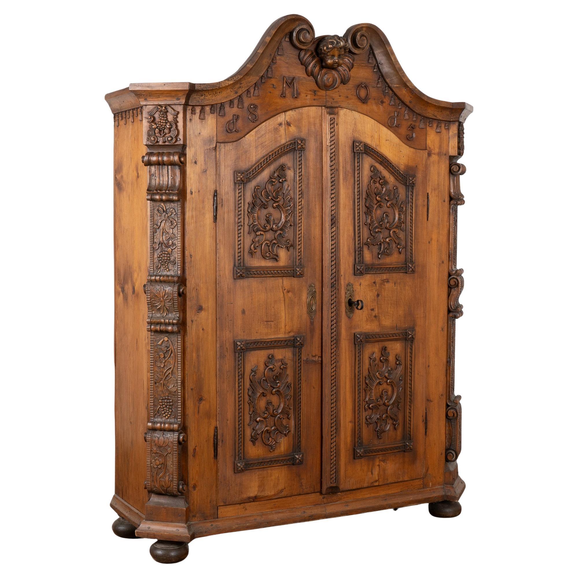 Heavily Carved Pine Armoire from Austria, dated 1815