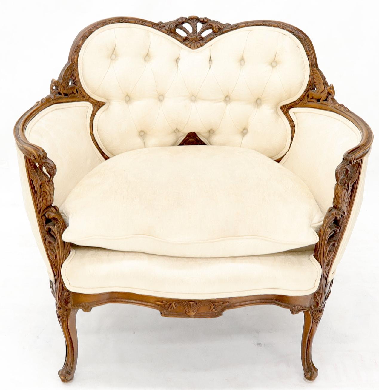 Vintage tufted back upholstery heavily carved walnut frame lounge fireside chair.