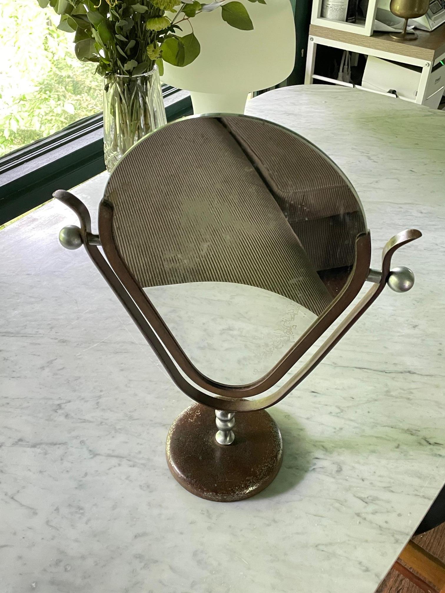 A double sided swivel table mirror, almost completely oxidized, but it is a survivor. By renowned designer Charles Hollis Jones in the USA, c.1960s. No cracks, no chips.

Estate fresh, found in an attic. All surfaces have lost the original sliver