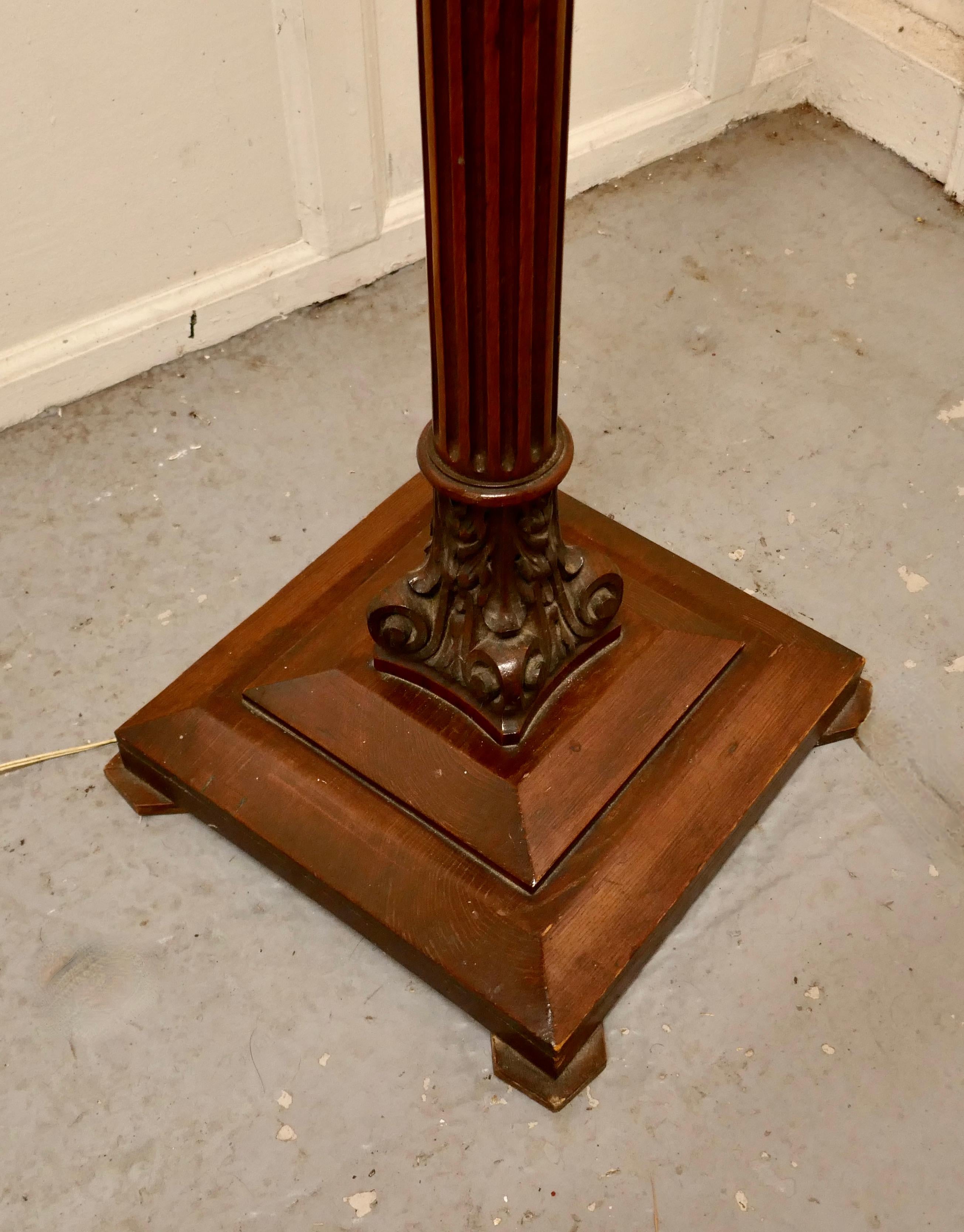Heavily turned oak floor standing lamp

This is an attractive piece in style of a Corinthian column with a stepped base and acanthus carvings at the top and the base 
The lamp is 62” high and the base is 15” square
GB679.
 