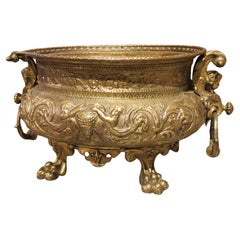 Heavily Worked 19th C. French Brass Jardiniere with Paw Feet and Cherub Handles