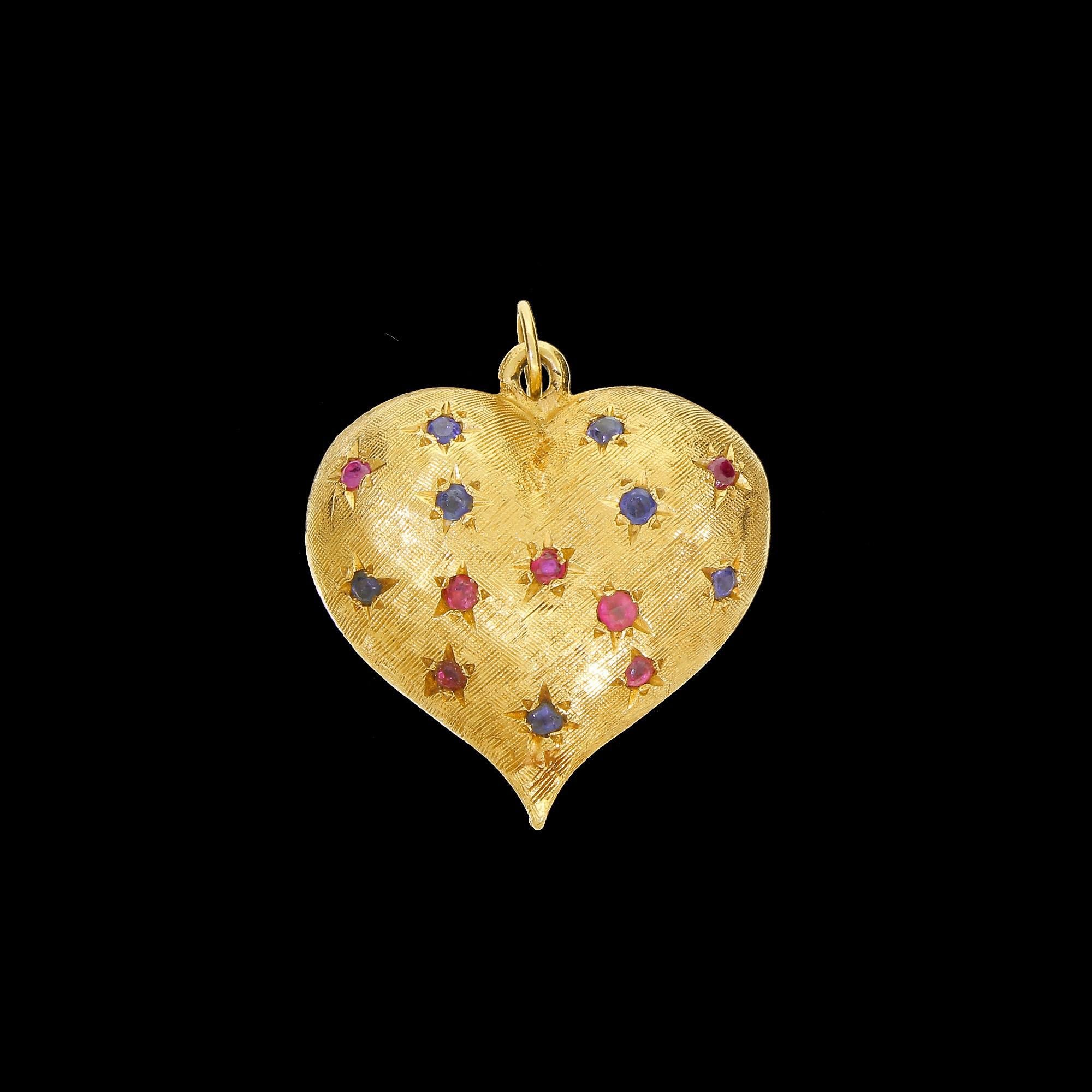 Crafted from 14K yellow gold and inset with genuine red ruby and blue sapphire gemstones, each with a star-shaped etching around the setting. 
Each side has a textured Florentine finish along with 14 ruby and sapphires gems, for a total of 28