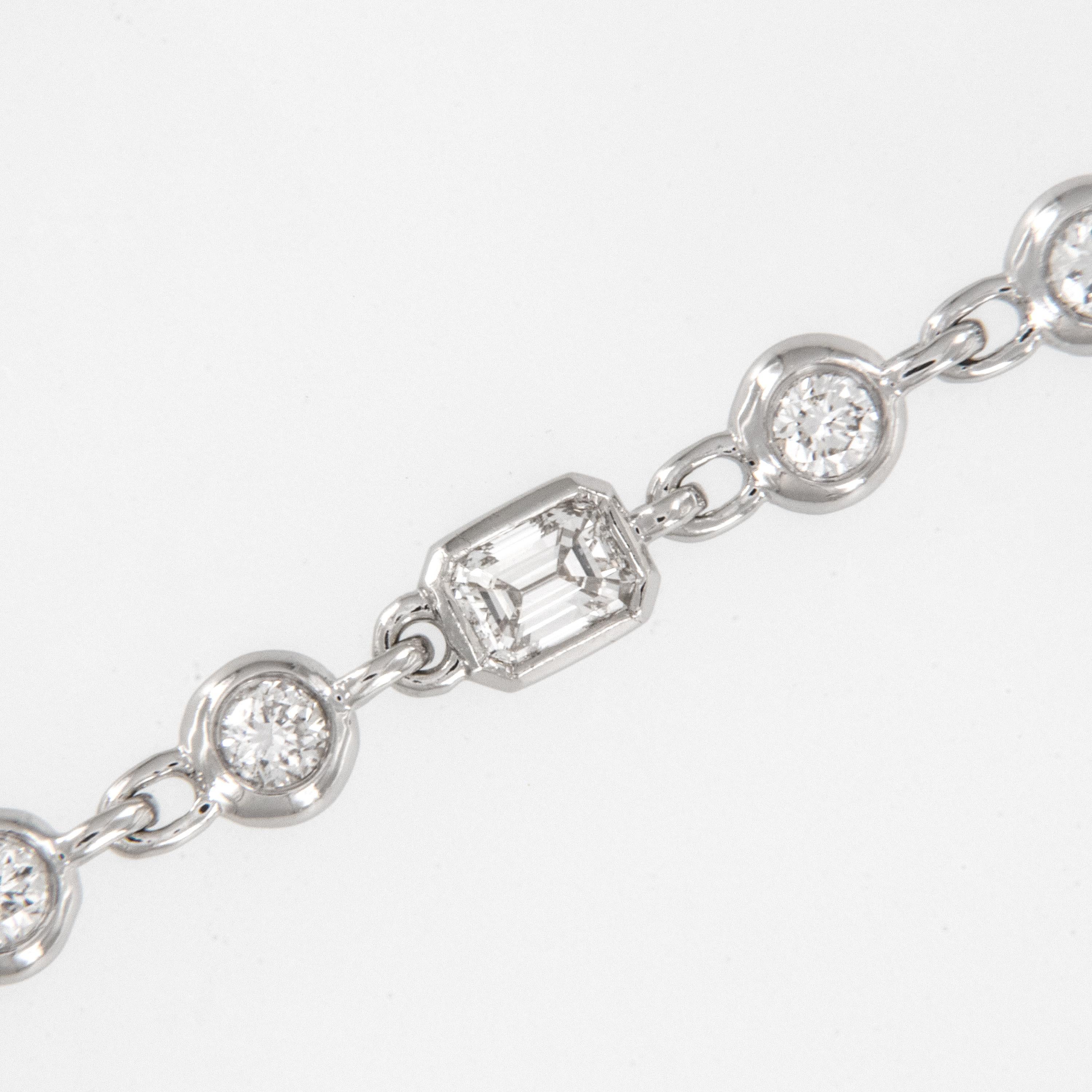 Why be like everyone else when you can be unique? Just like this timeless diamonds by the yard necklace with alternating sections of bezel set round brilliant diamonds with three emerald cut diamonds sprinkled in for interest! Made from rich 18