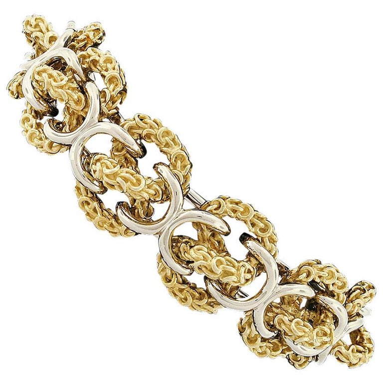 Heavy 18 Karat Yellow and White Gold Wide 3D Infinity Knot Chain Bracelet For Sale at 1stDibs