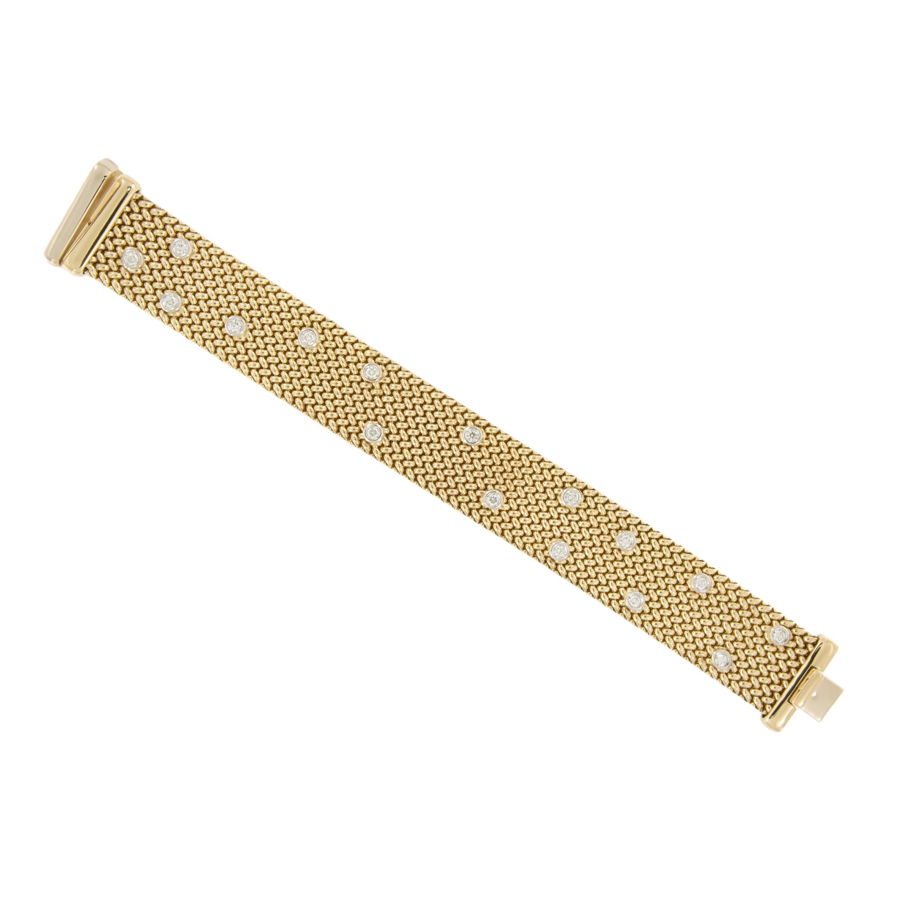 The expert craftsmanship is evident here in this beautiful Italian mesh bracelet made of rich 18 karat yellow gold. This bracelet is as comfortable on as it is stunning! The wide woven bracelet is set with 16 VS, F-G RBC diamonds = 1.20 Cttw and is
