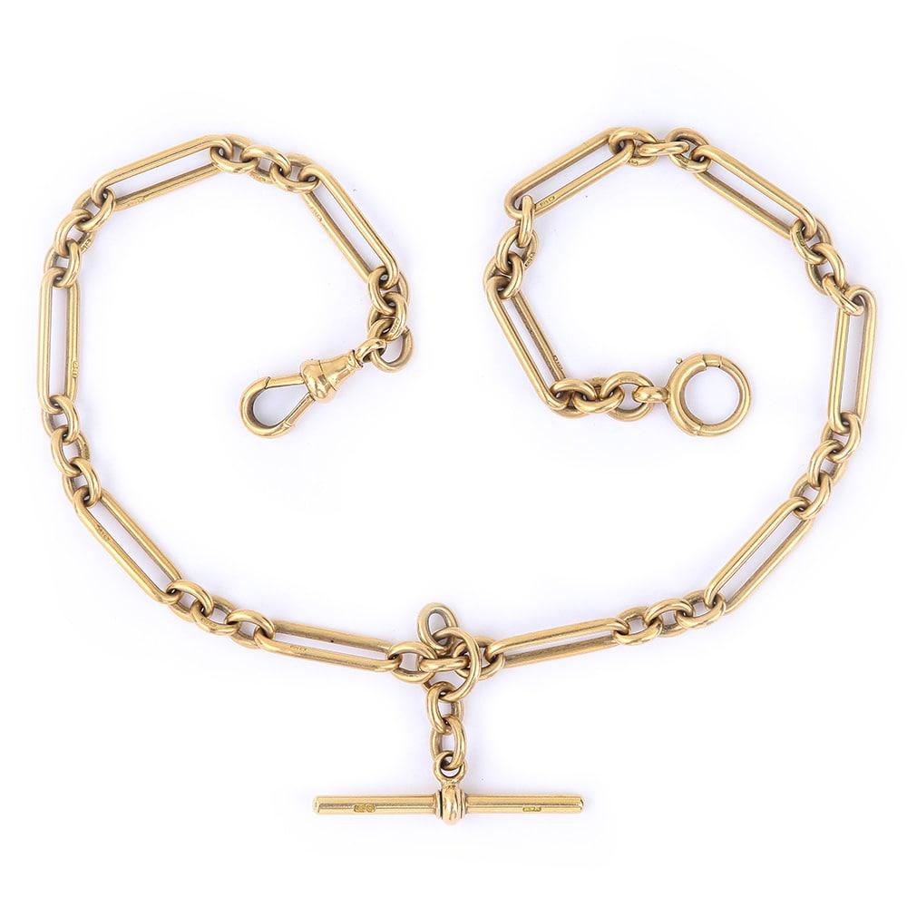A solid, heavy 18 karat yellow gold antique Edwardian Albert chain with alternating trombone & round uniform links with a T-bar. Every link is stamped ‘18' with the crown assay mark, a common finesse mark in England, the anchor for Birmingham and a