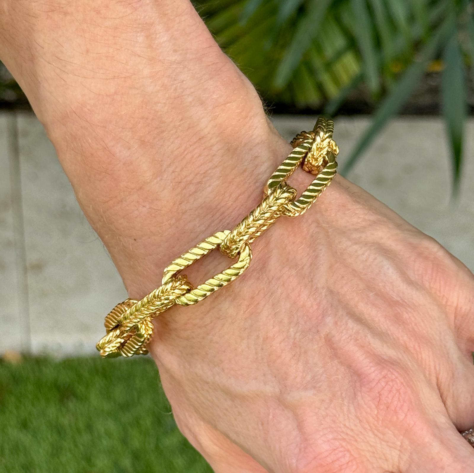 The Heavy Rectangular Link Toggle Bracelet is a luxurious and bold statement piece. Featuring intricate rectangular links in a classic wheat pattern, this bracelet is crafted from substantial 18 karat yellow gold. The two diamonds set in the toggle