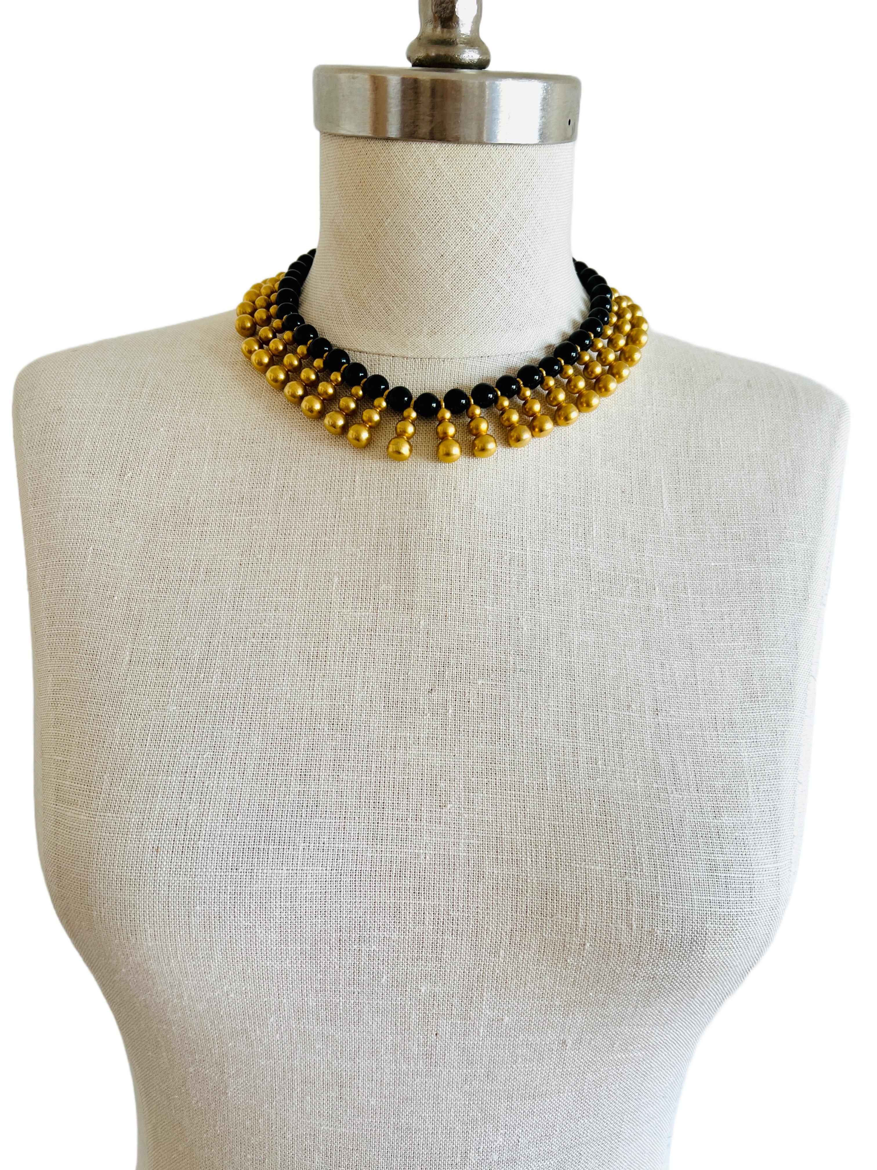 This amazing and rich Egyptian revival bib necklace is very well constructed, weighing 184 grams!

Size: It measures approximately 15.5