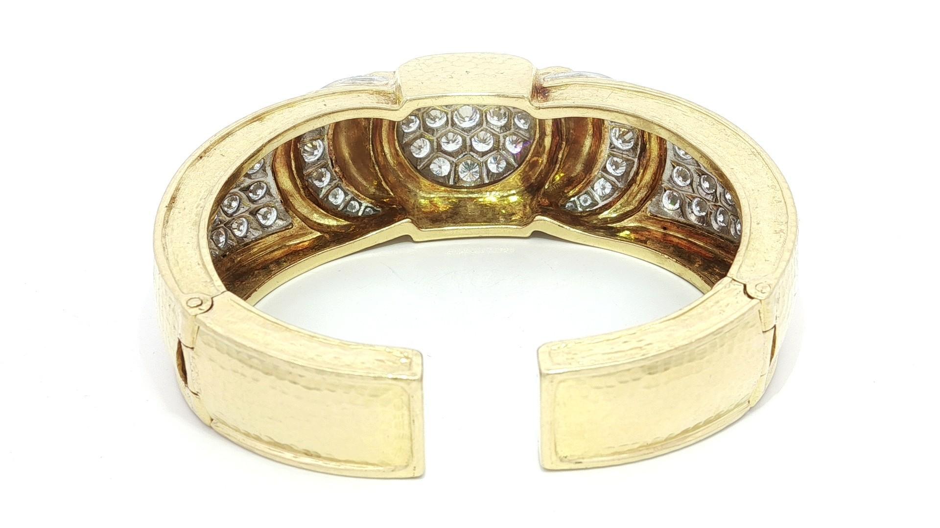 Statement Piece!!!
--Stone(s):-- 
(69) Natural Genuine Diamonds - Round Brilliant Cut - Pave Set - F/G Color - VVS2-VS2 Clarity - 12ctw (approx.)

Material: Solid 18K Yellow Gold & Platinum
Weight: 91.5 Grams
Type: Hinged Open Cuff Bangle
Size: Will