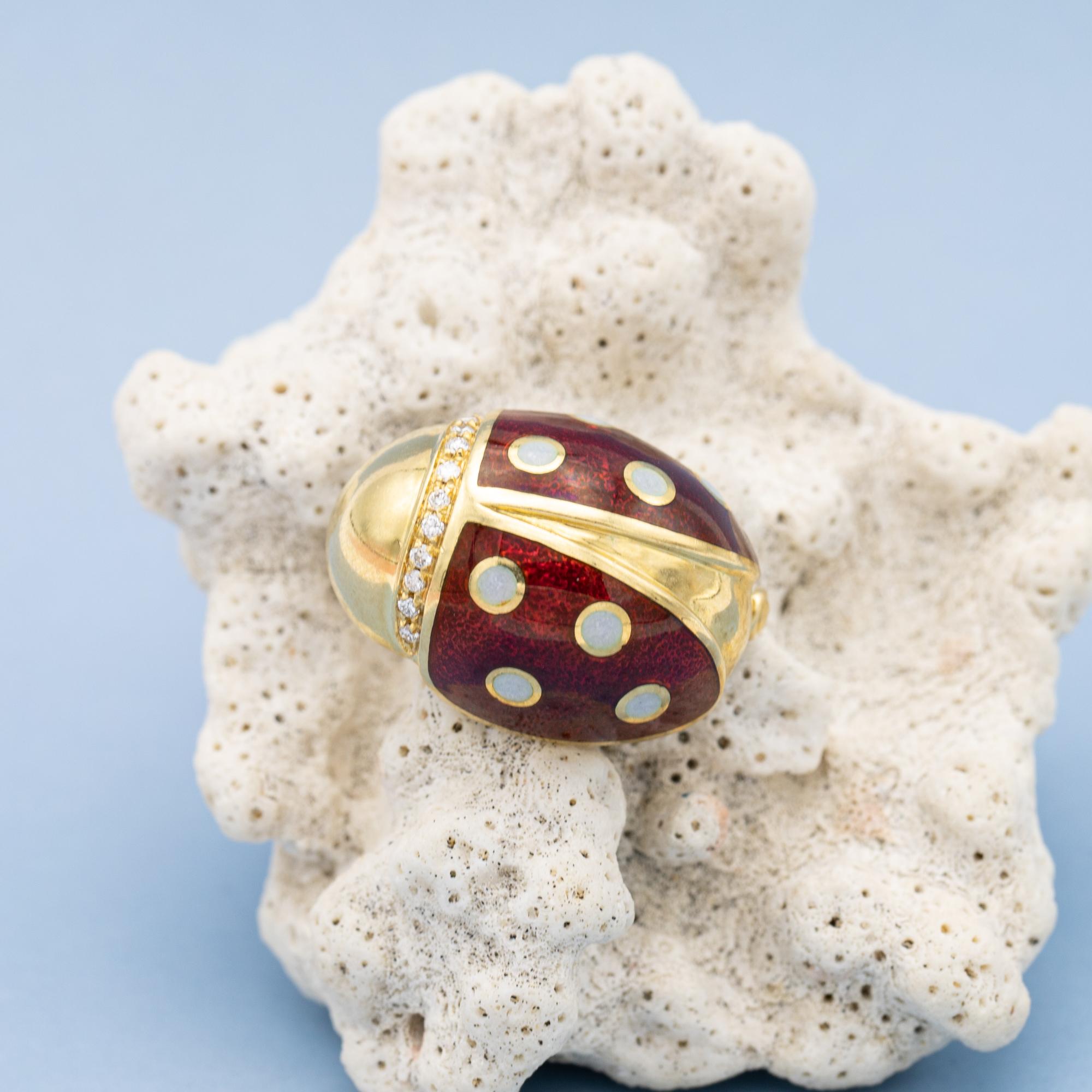 For sale is this wonderful Italian Ladybug brooch. This 18k yellow gold animal is set with 11 small but bright brilliant cut diamonds, which combine for approx 0,05 ct. A warm red tint of enamel in combination with the white little dots decorate the