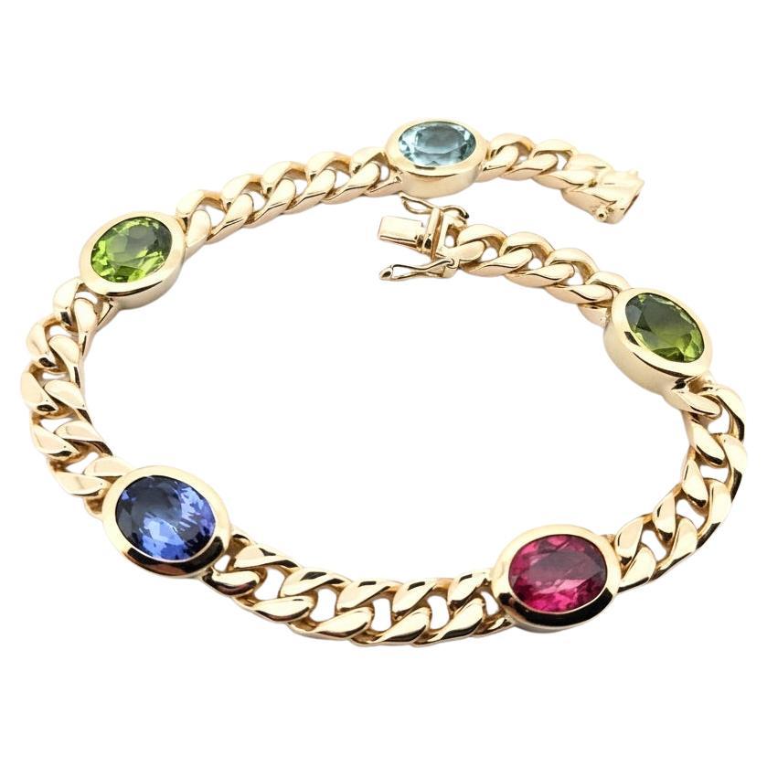 Heavy 18K Yellow Gold Curb Chain Bracelet with Aquamarine, Tanzanite, Tourmaline For Sale