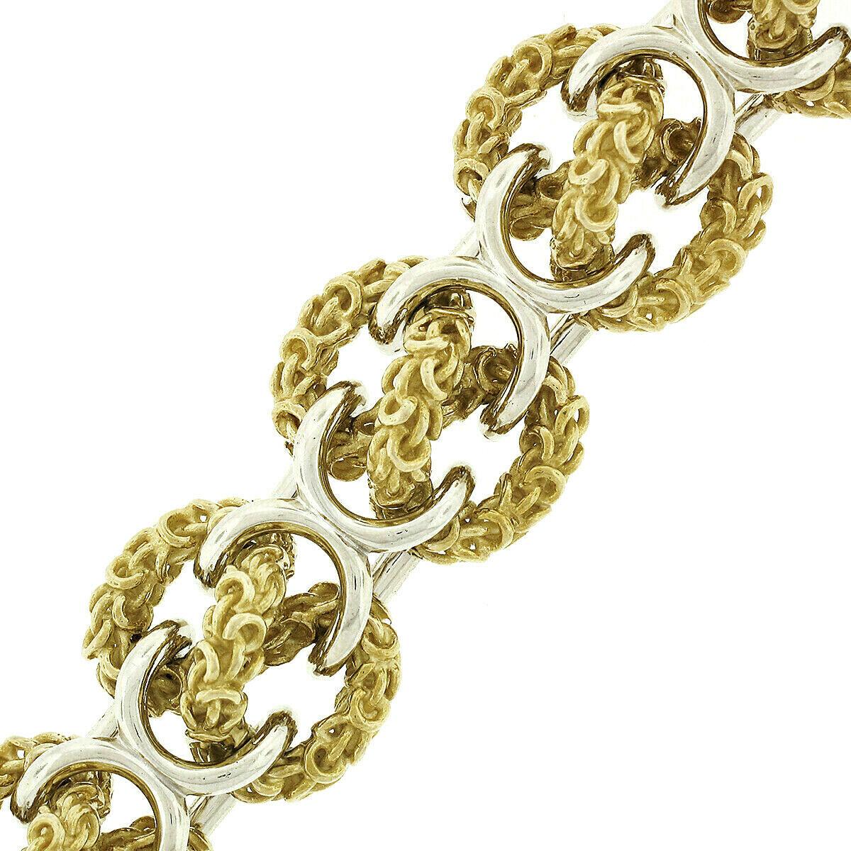 Heavy 18 Karat Yellow and White Gold Wide 3D Infinity Knot Chain Bracelet In Good Condition For Sale In Montclair, NJ