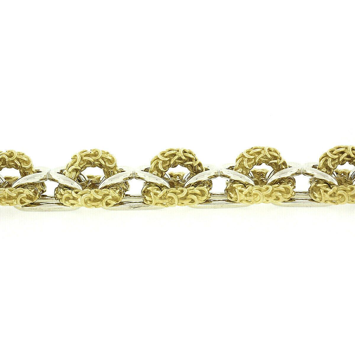 Heavy 18 Karat Yellow and White Gold Wide 3D Infinity Knot Chain Bracelet For Sale 1