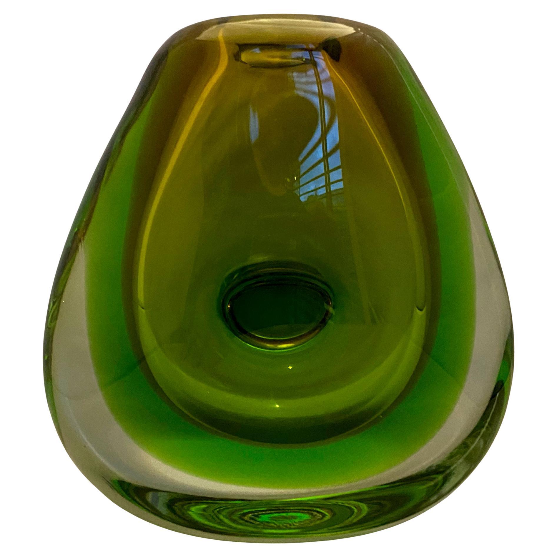 Heavy, thick and beautifully made mid century green glass vase. 