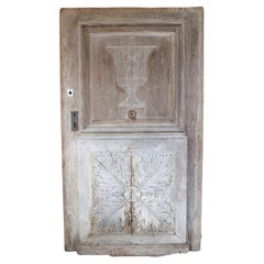 Antique Heavy 19th Century French Walnut Entry Door with Carved Urn and Foliate Motifs