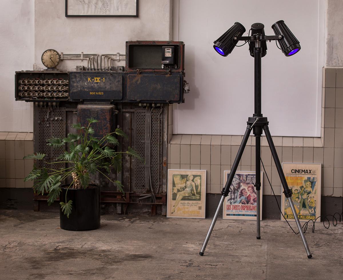 From small to very large adjustable lamp. 
Made from original (Dutch brand) Cambo DPS studio tripod with heavy-duty explosive-proof iron lamp-units (brand unknown).
Tripod original mat paint, lamps glossy industrial black paint.
The three lamps