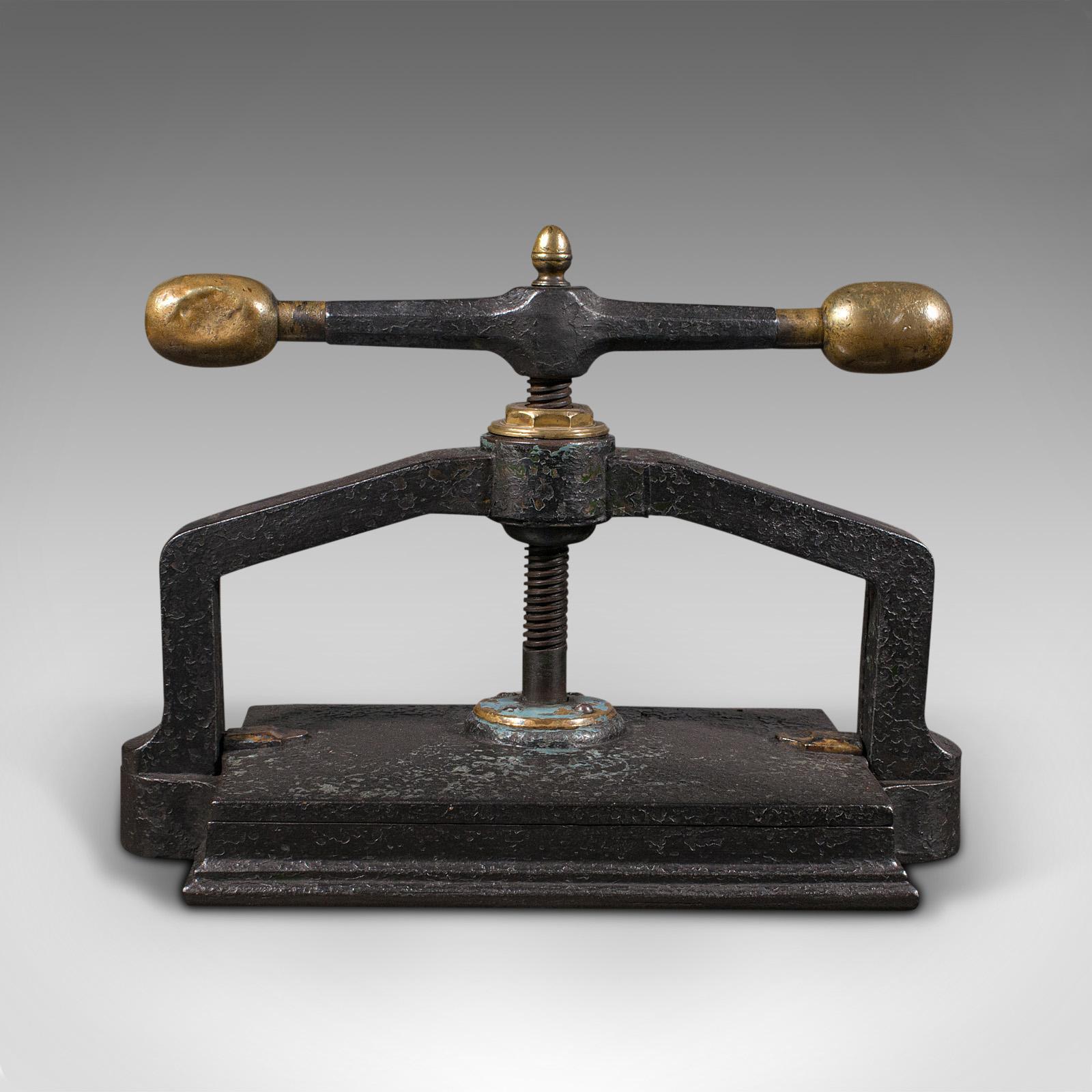 This is a heavy antique book press. An English, cast iron binding or flower pressing device, dating to the Georgian period, circa 1800.

Indulge your literary interests with this fascinating antique press
Displays a desirable aged patina
