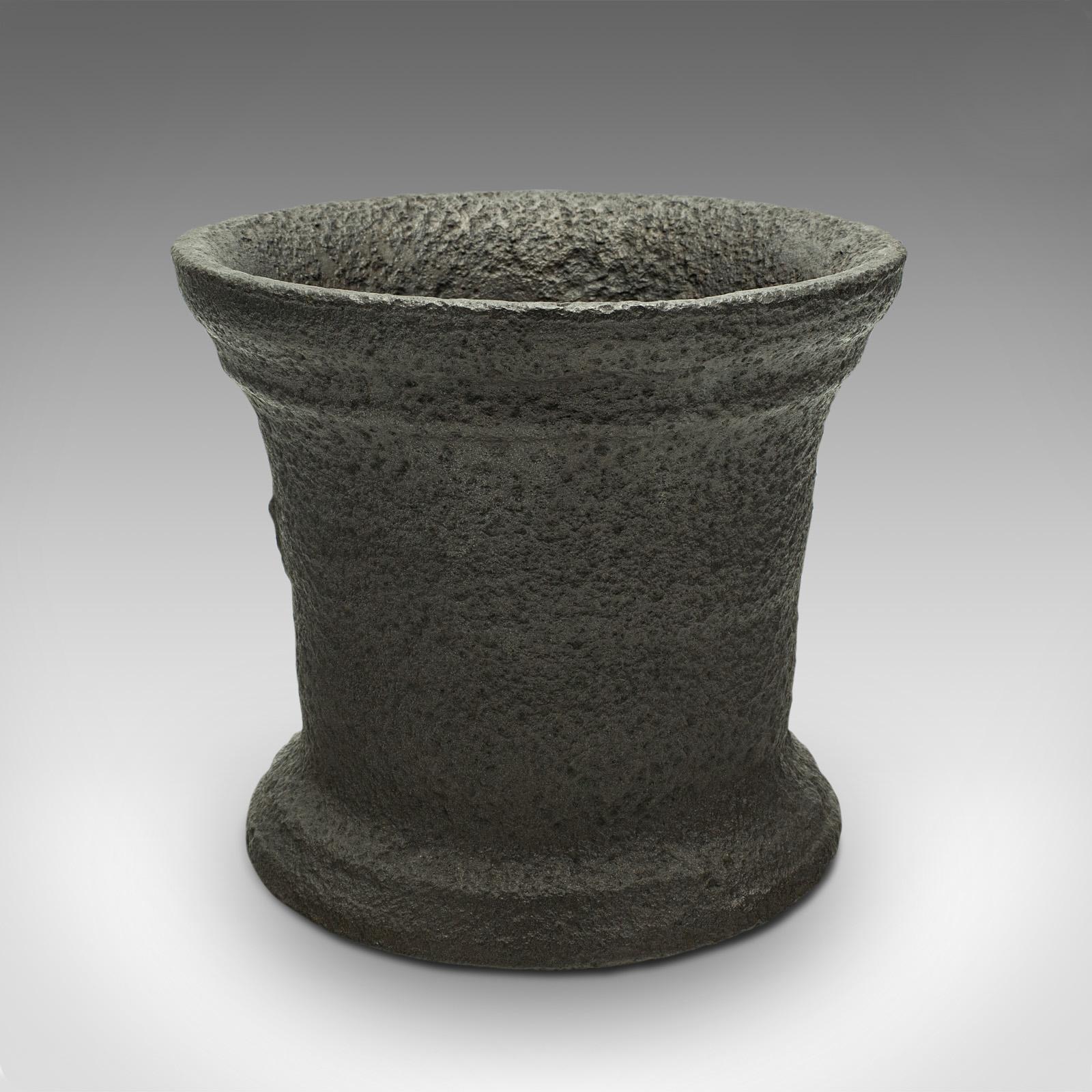 This is a heavy antique chemist's mortar. An English, cast iron decorative planter pot, dating to the mid Georgian period, circa 1750.

Fascinatingly weathered Georgian mortar
Displaying a desirable aged patina throughout
Substantial cast iron