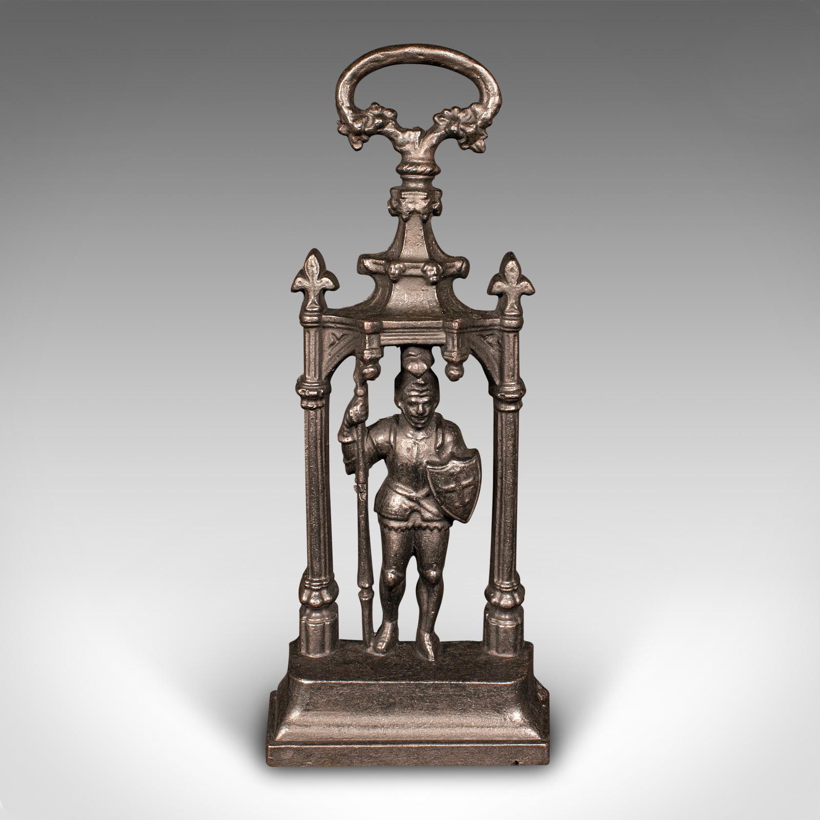 
This is a heavy antique door sentry. An English, cast iron knight doorstop, dating to the early Victorian period, circa 1850.

Substantial, charming door stop with a delightful visual appeal
Displays a desirable aged patina and in good order
Robust