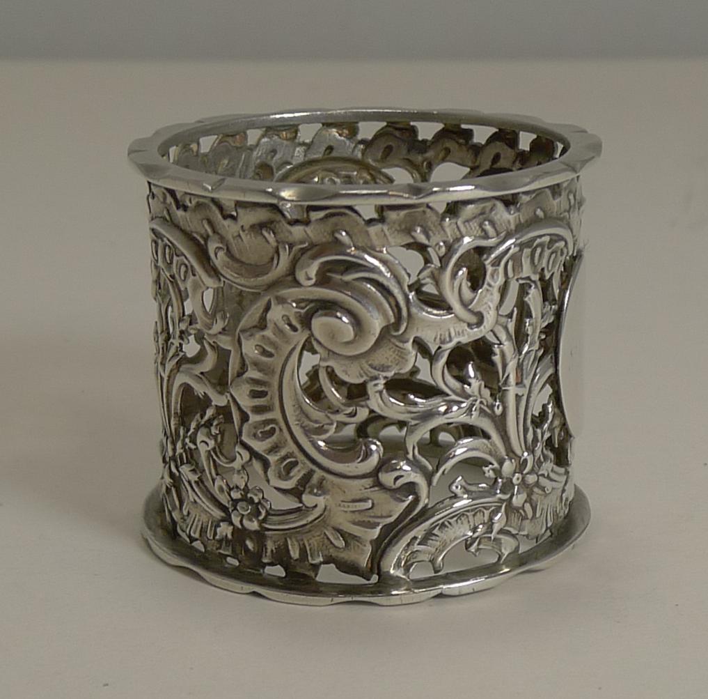 A lovely Victorian napkin ring made by a weighty piece of English sterling silver with pierced or reticulated decoration and incorporating a vacant oval mount to the front.

Fully hallmarked for Birmingham 1895 together with the makers mark for T.