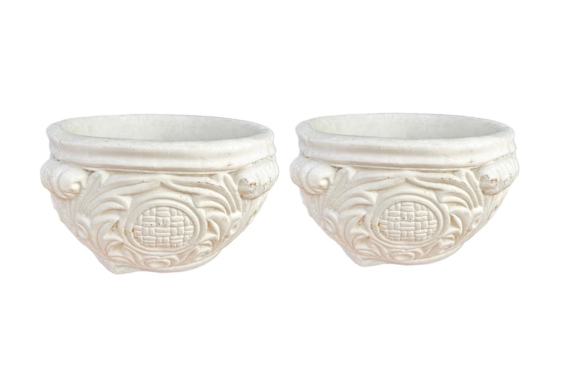 PAIR' of circa 1930s, vintage Asian inspired cast concrete Garden ( Heavy) planters with four scroll handles and leaves which surround a central medallion with a basket weave pattern on all four panels. Have been out of the harsh elements for over